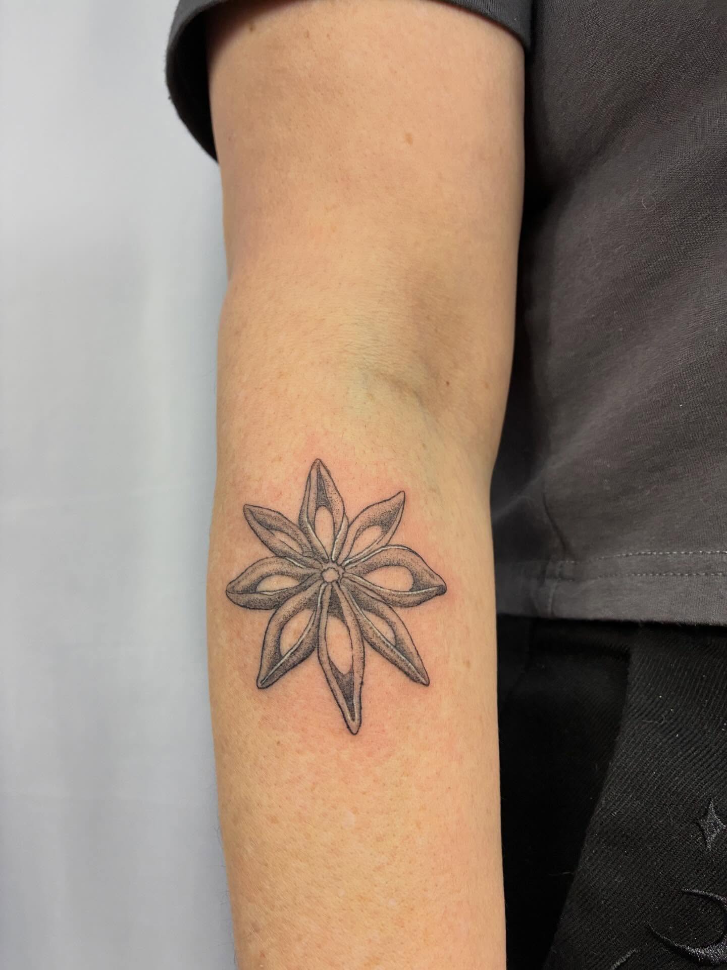 Star anise geometric tattoo on the forearm by ⊹ Avery Peterson ⊹