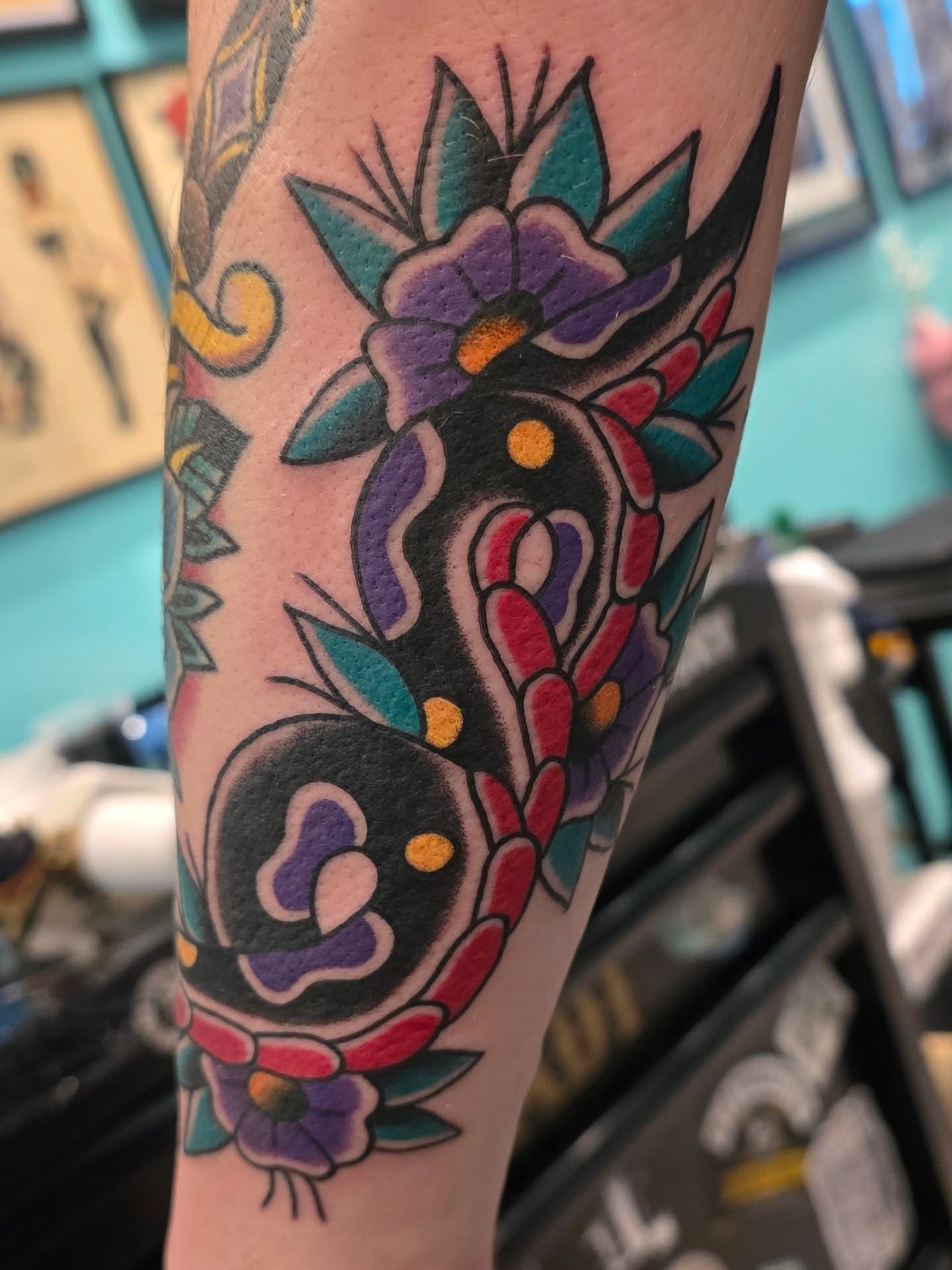 Flower bouquet American traditional tattoo on the forearm by A. Teixeira, Los Angeles, California