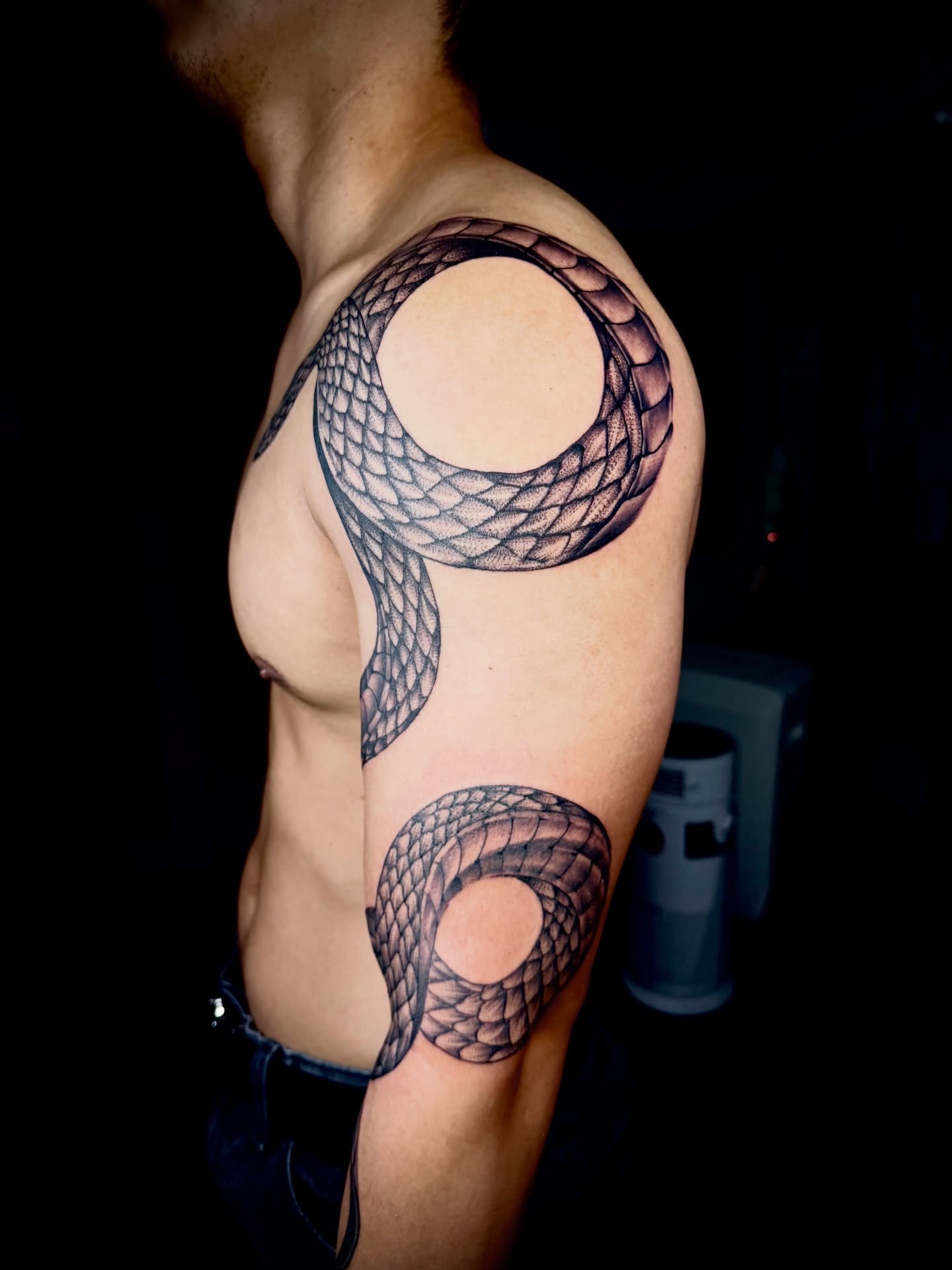 Snake black and grey tattoo on the shoulder by John Ayson, Murrieta, California