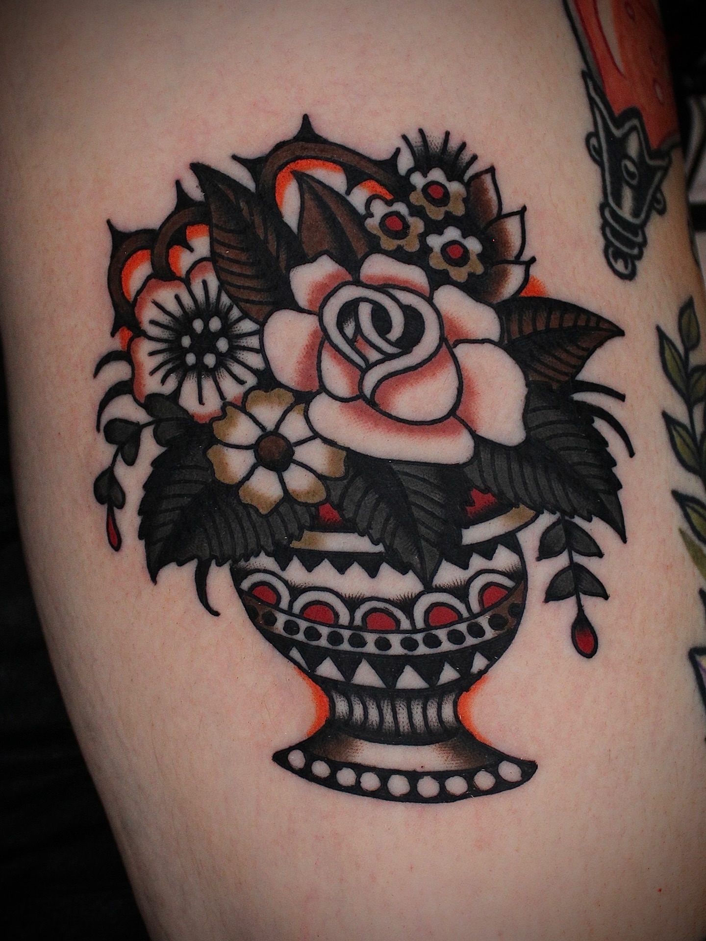 Flower arrangement American traditional tattoo on the thigh by Dustin Stemen, Charlotte, North Carolina