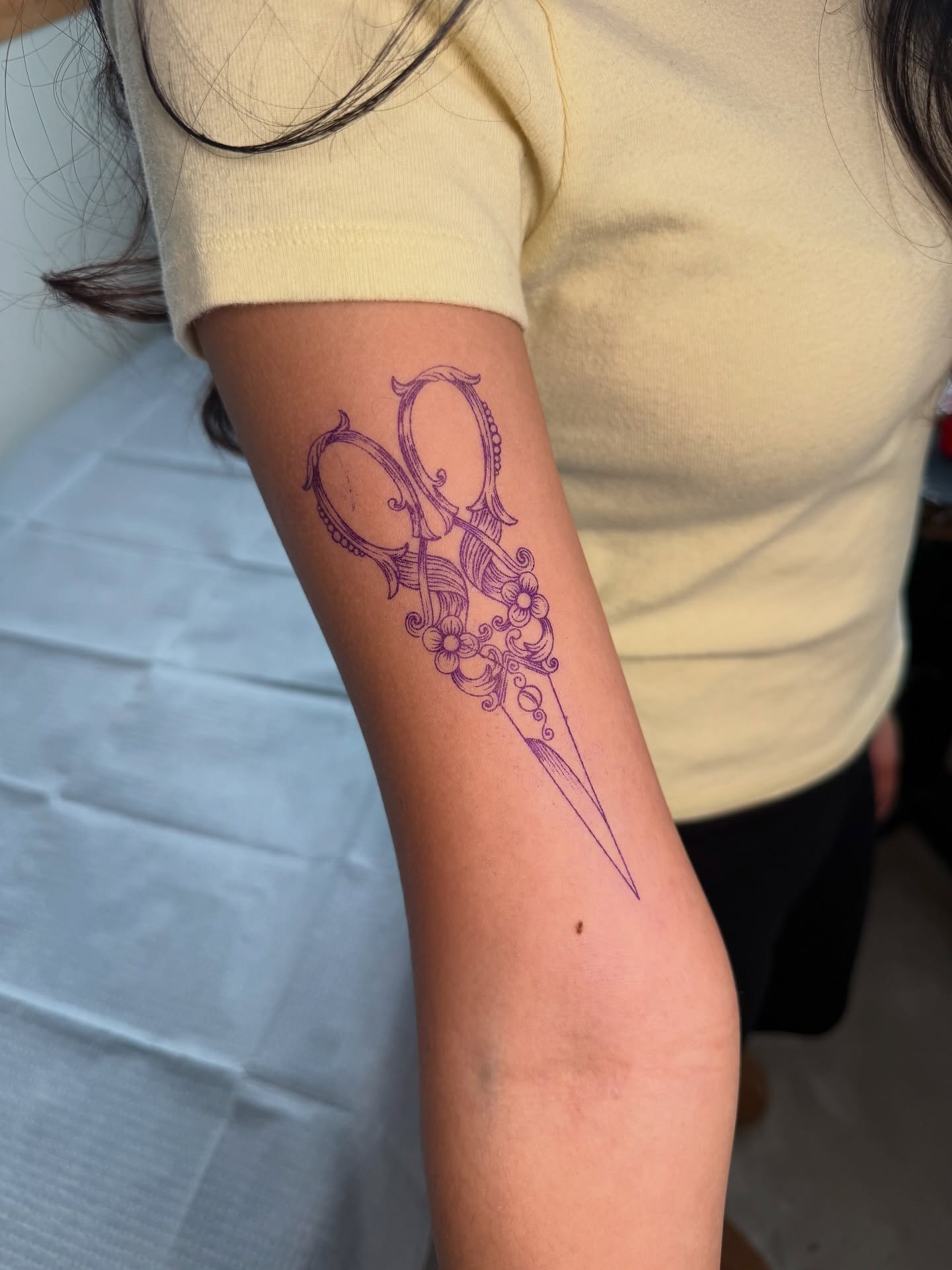 Scissors and flower ornamental tattoo on the forearm by aamora ꩜