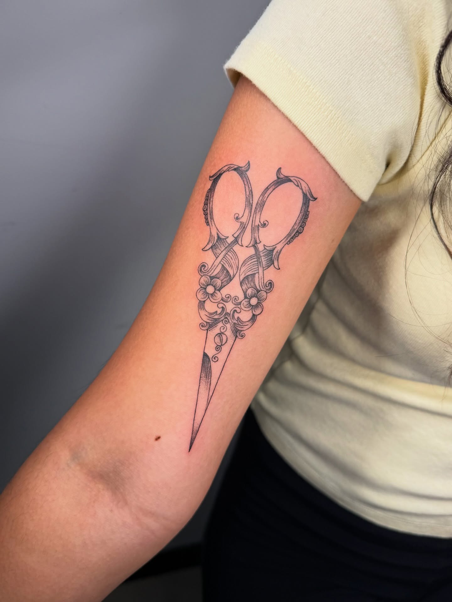 Scissors black and grey tattoo on the forearm by aamora ꩜