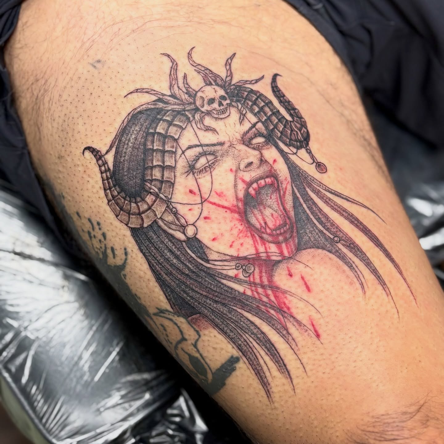 Woman with horns and skull dark realism tattoo on the thigh by sydney honn