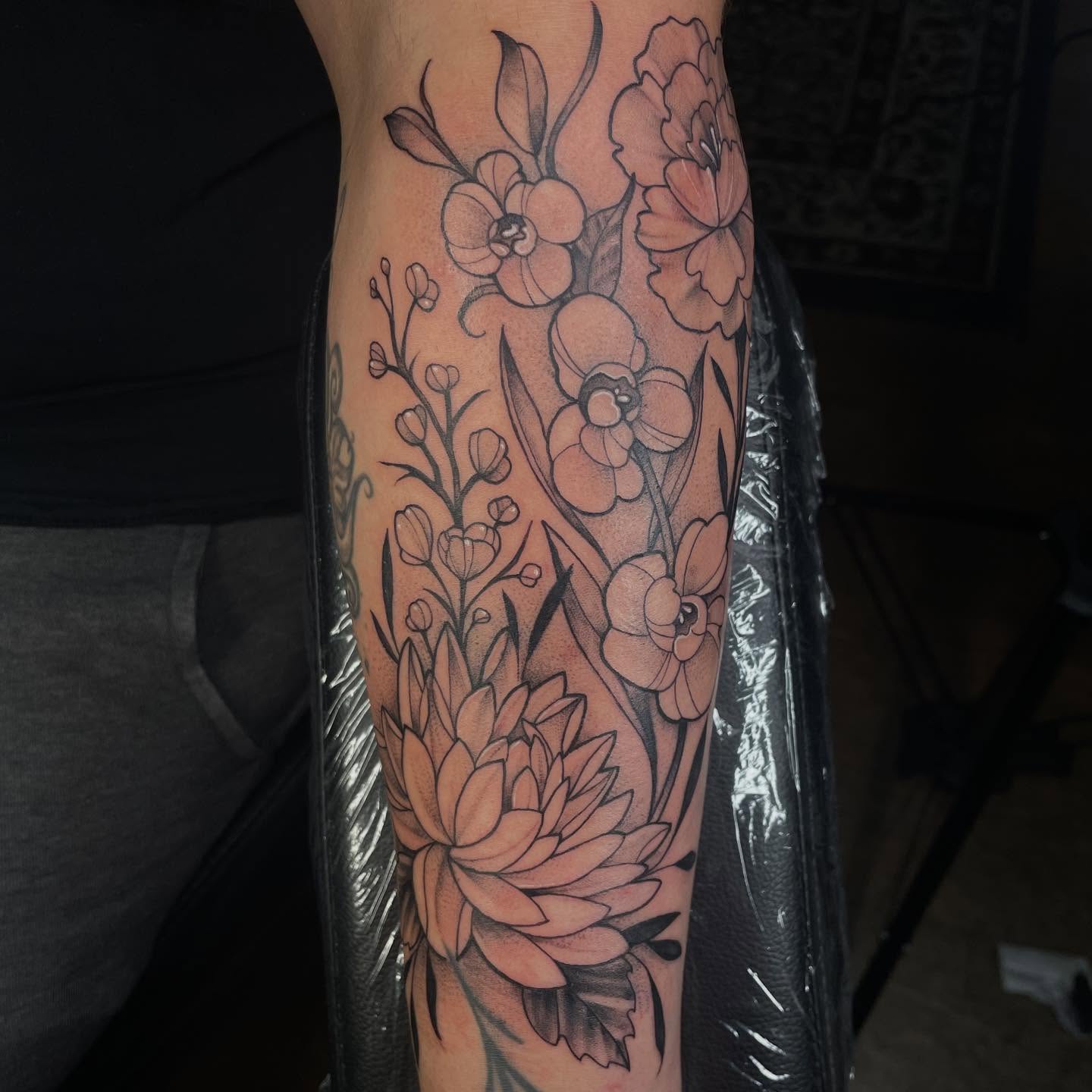 Floral bouquet black and grey tattoo on the forearm by Lauren Sisouphanh, Canton, Ohio