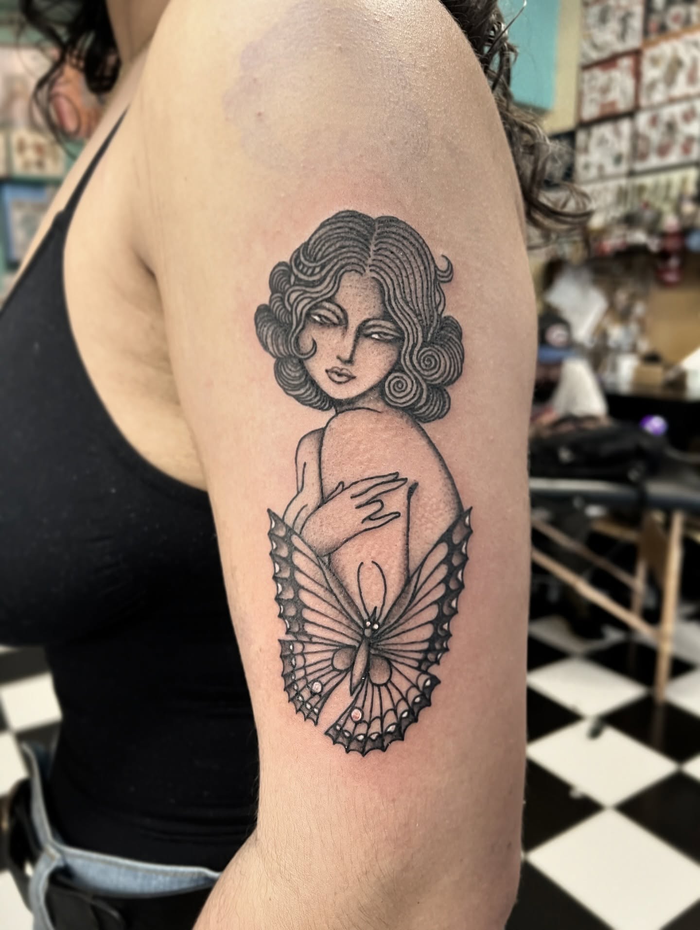 Woman with butterfly wings realism tattoo on the upper arm by superteal