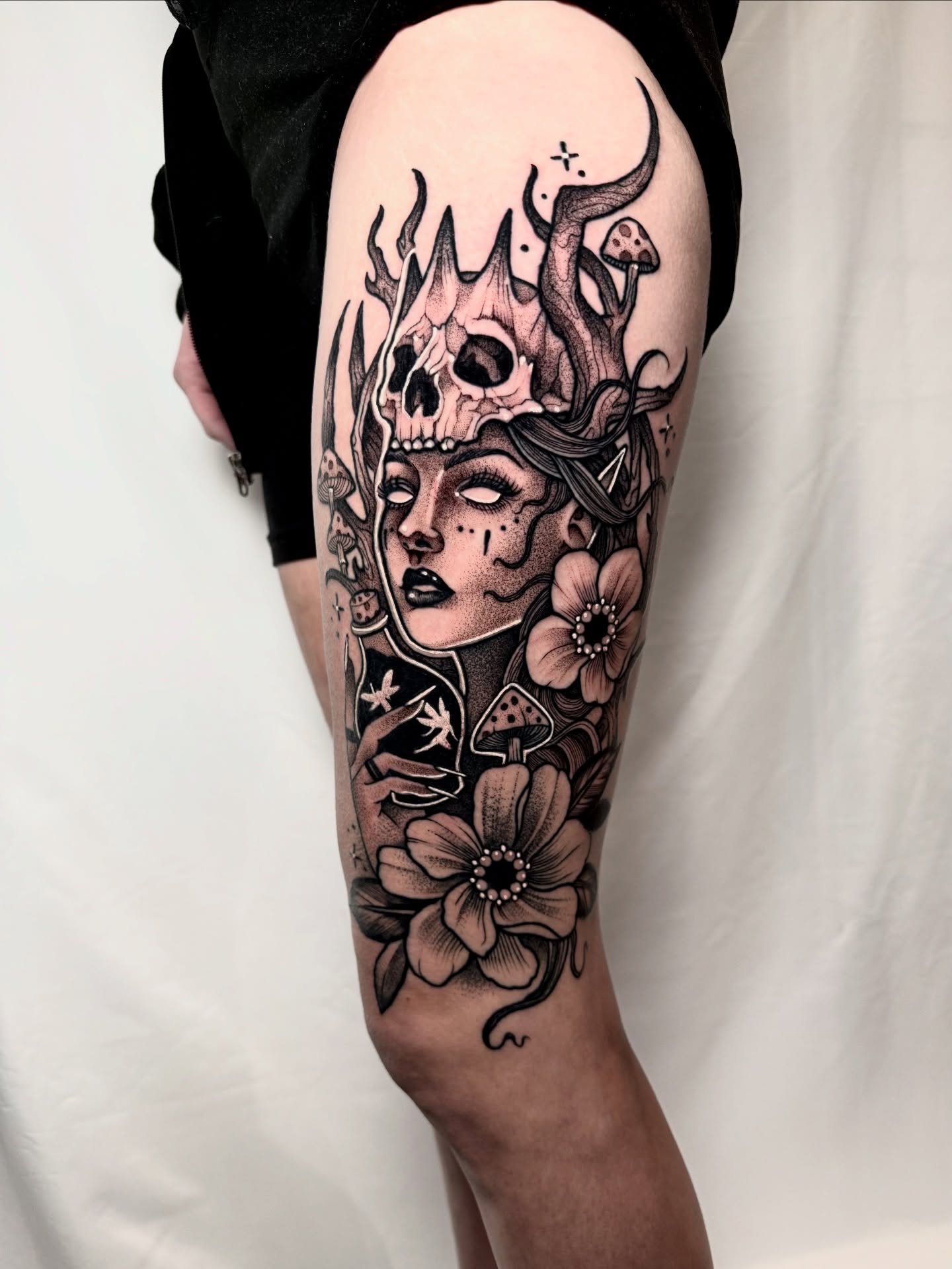 Woman with skull crown dark realism tattoo on the thigh by ⚡️ Krissy Fabis ⚡️