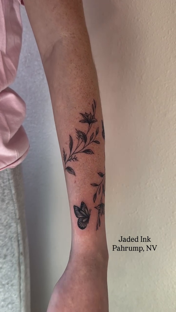 Floral branch with butterflies fine line tattoo on the forearm by 𝑱𝒂𝒅𝒆𝒅 𝑰𝒏𝒌 𝑷𝒆𝒓𝒎𝒂𝒏𝒆𝒏𝒕 𝑴𝒂𝒌𝒆𝒖𝒑 & 𝑻𝒂𝒕𝒕𝒐𝒐