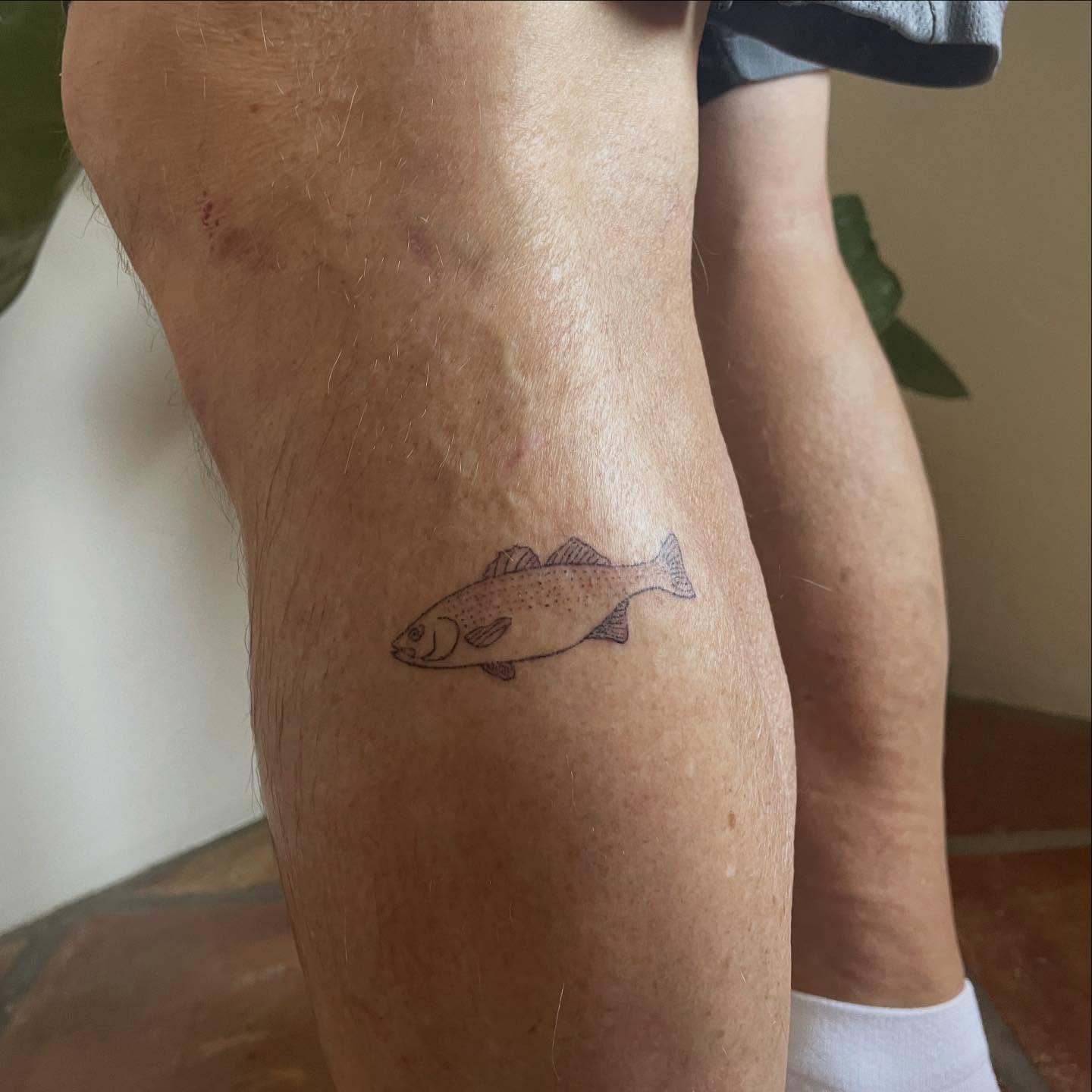 Fish dotwork tattoo on the leg by Alyssa