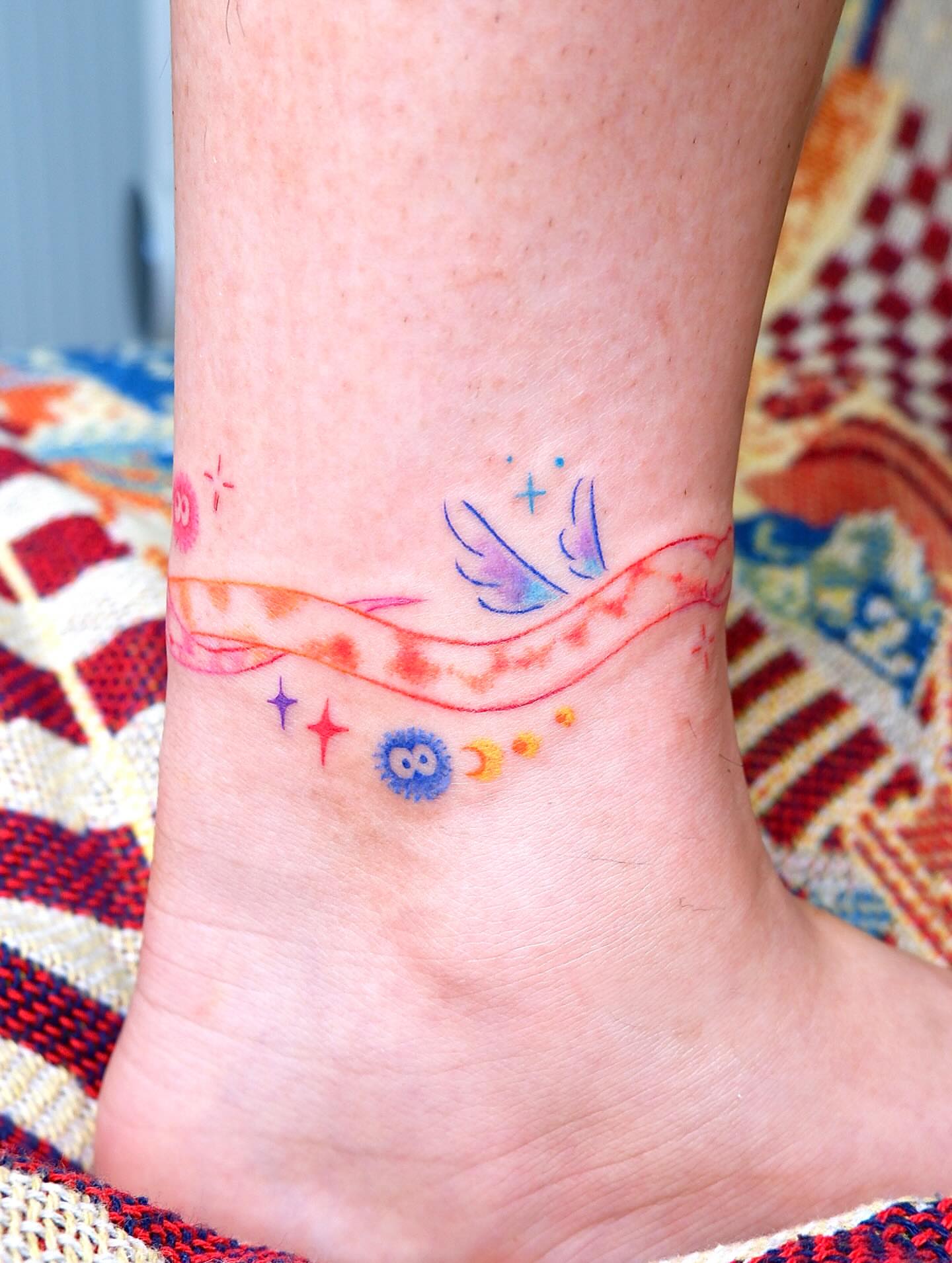Astronomical symbols watercolor tattoo on the foot by 타투 Seon 컬러타투