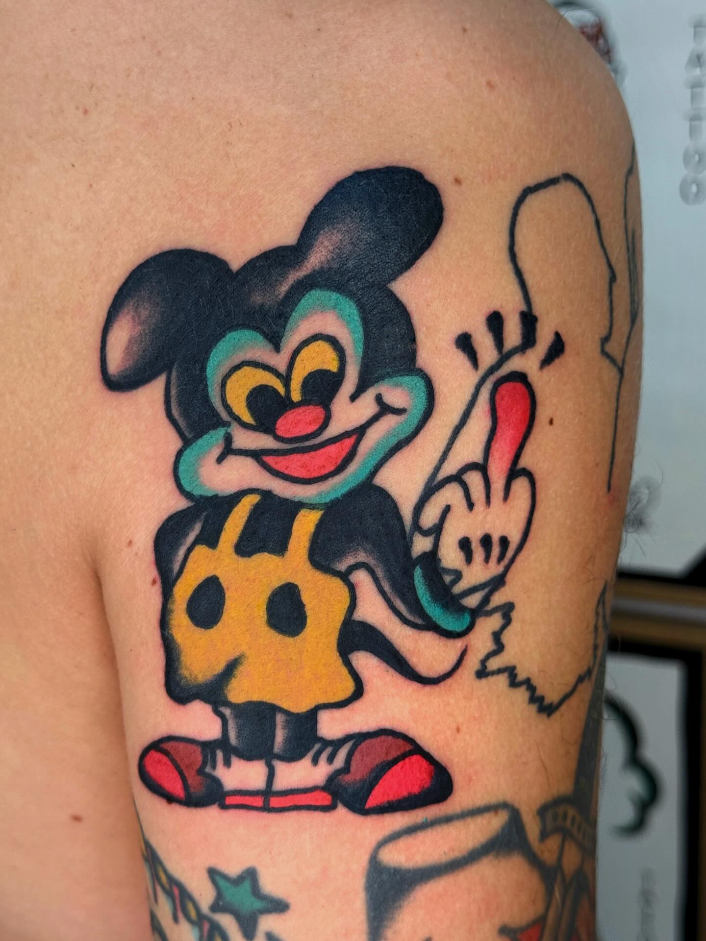 Casper the Friendly Ghost American traditional tattoo on the shoulder by Jimmy Ho