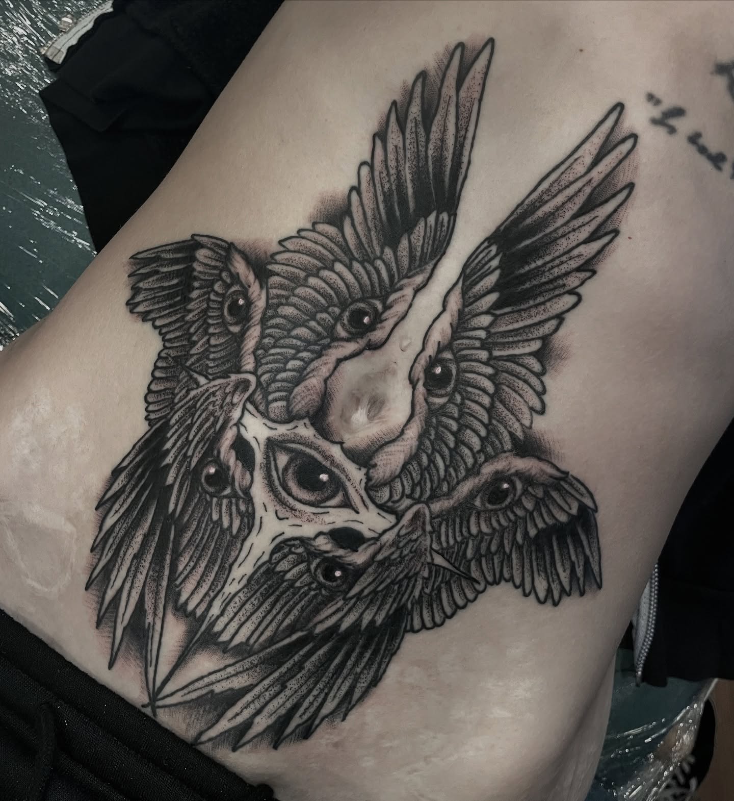 Owl dotwork tattoo on the thigh by Ian Spong