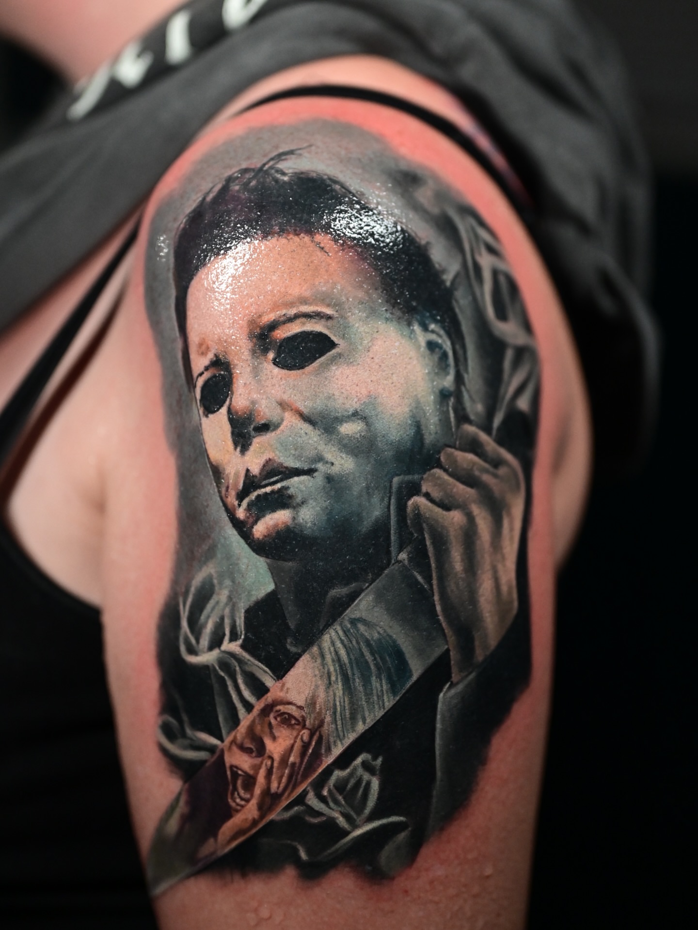 Michael Myers mask realism tattoo on the shoulder by Kelsey Kemp