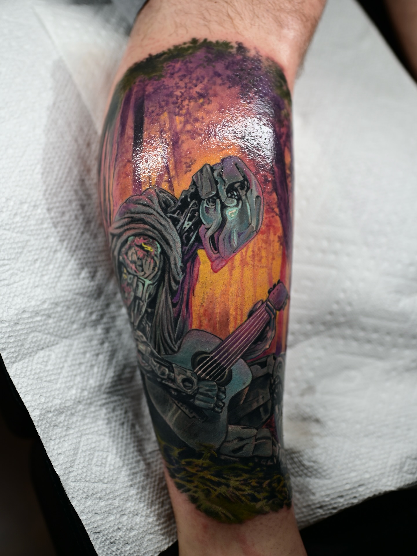 Guitarist playing guitar realism tattoo on the forearm by Kelsey Kemp