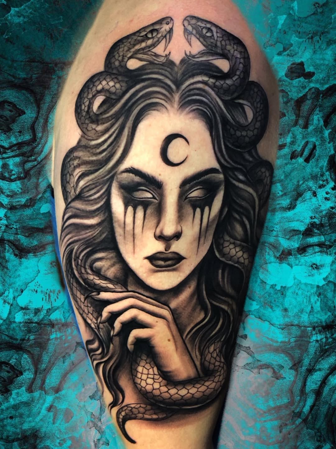 Woman with snakes and moon realism tattoo on the forearm by Luis Chauta