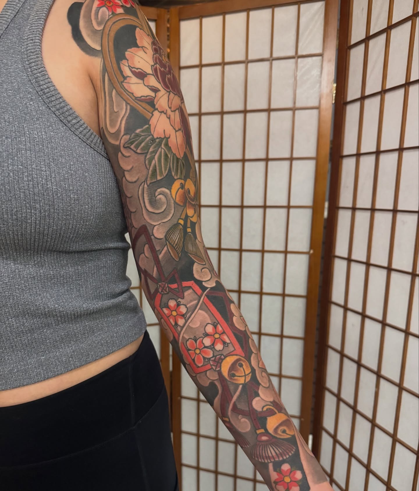 Floral and geometric japanese irezumi tattoo on the forearm by Dylan