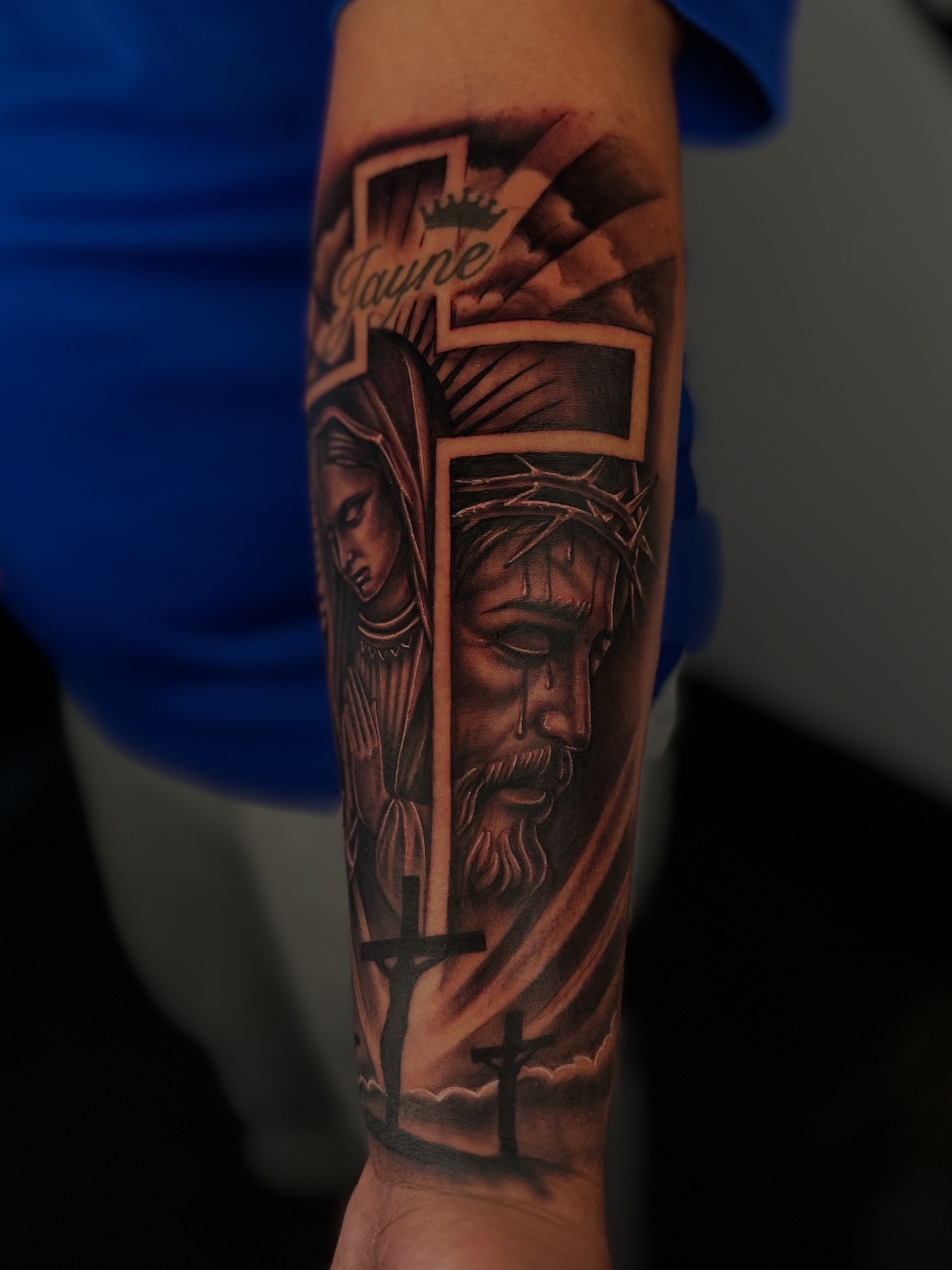 Religious figures realism tattoo on the forearm by Dreamchaserink
