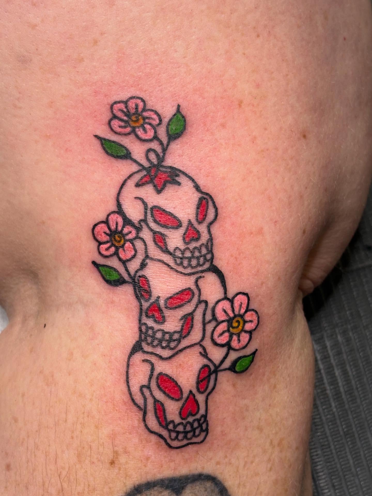 Skulls and flowers American traditional tattoo on the ribs by ☻︎ Cyd Precious ☹︎
