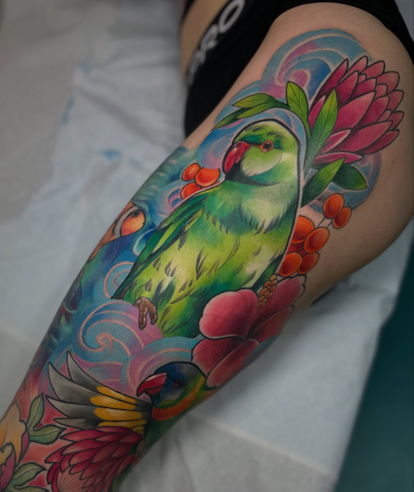 Parrot and flowers new school tattoo on the thigh by โ ๐ฟ๐๐ ๐ญ๐๐๐๐