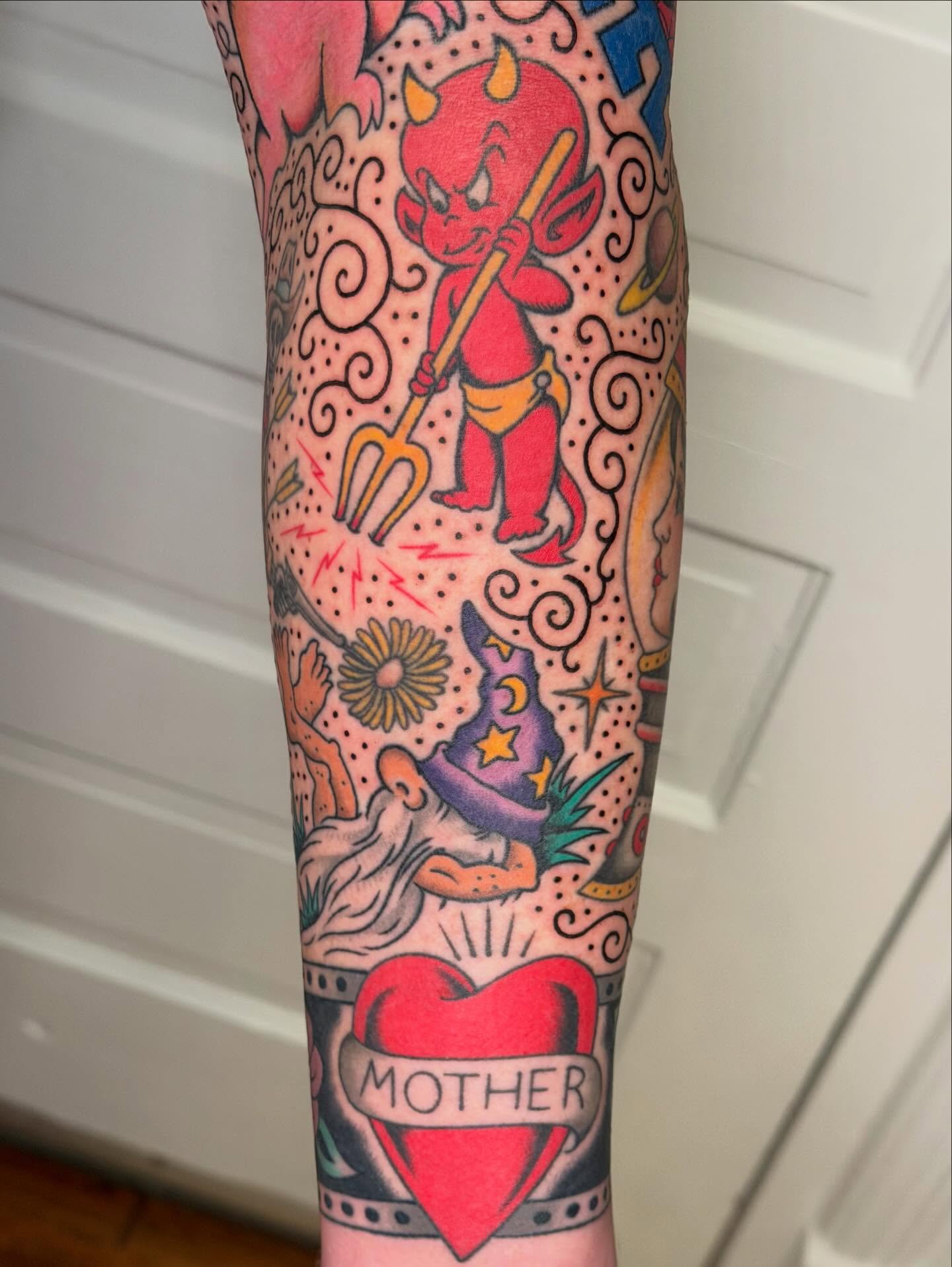 Devil and wizard American traditional tattoo on the forearm by Michael Barnhill Tattooer, Charlotte, North Carolina