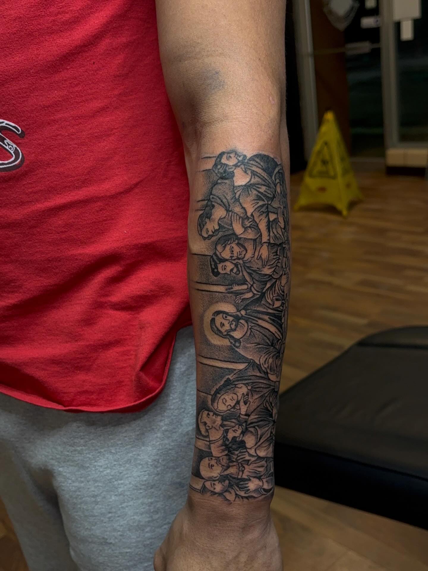 Religious scene black and grey tattoo on the forearm by 𓂀 𝕊ℍ𝔼𝕃𝕃𝕐 𓂀