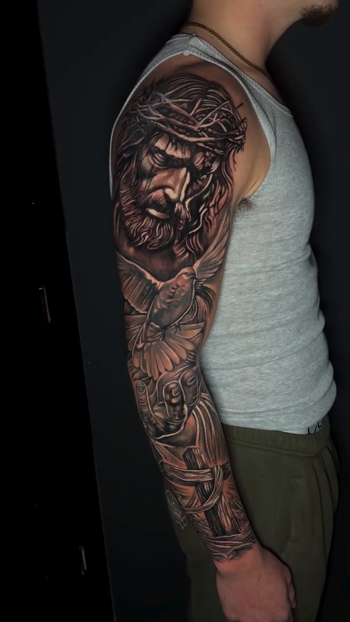 Jesus Christ with doves realism tattoo by Paul burrows (Tatttoo Artist)