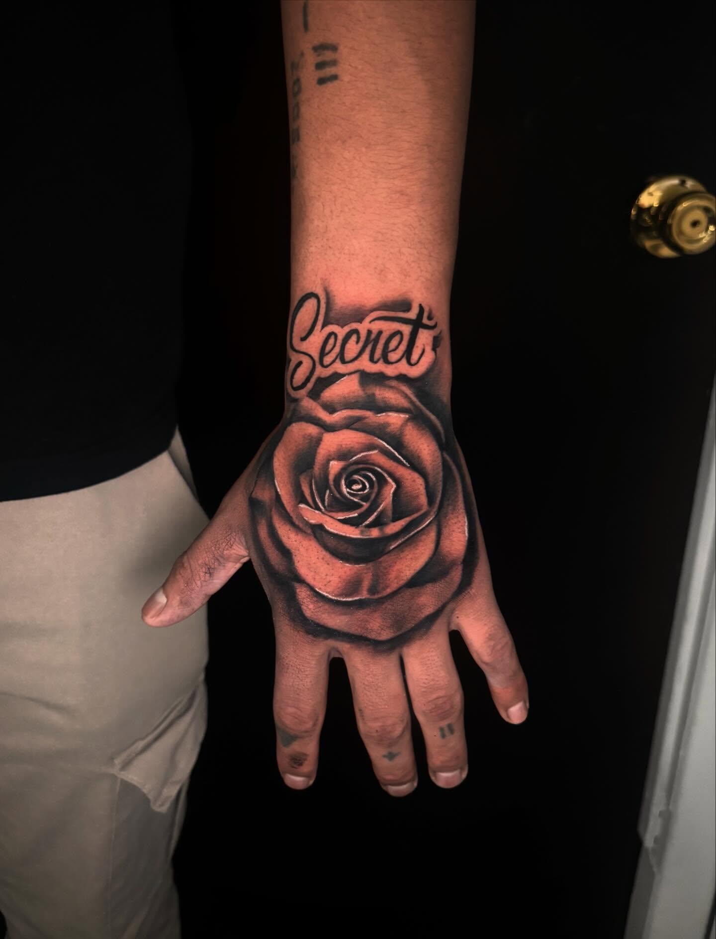 Rose realism tattoo on the hand by Daero Tattoo, New York, New York