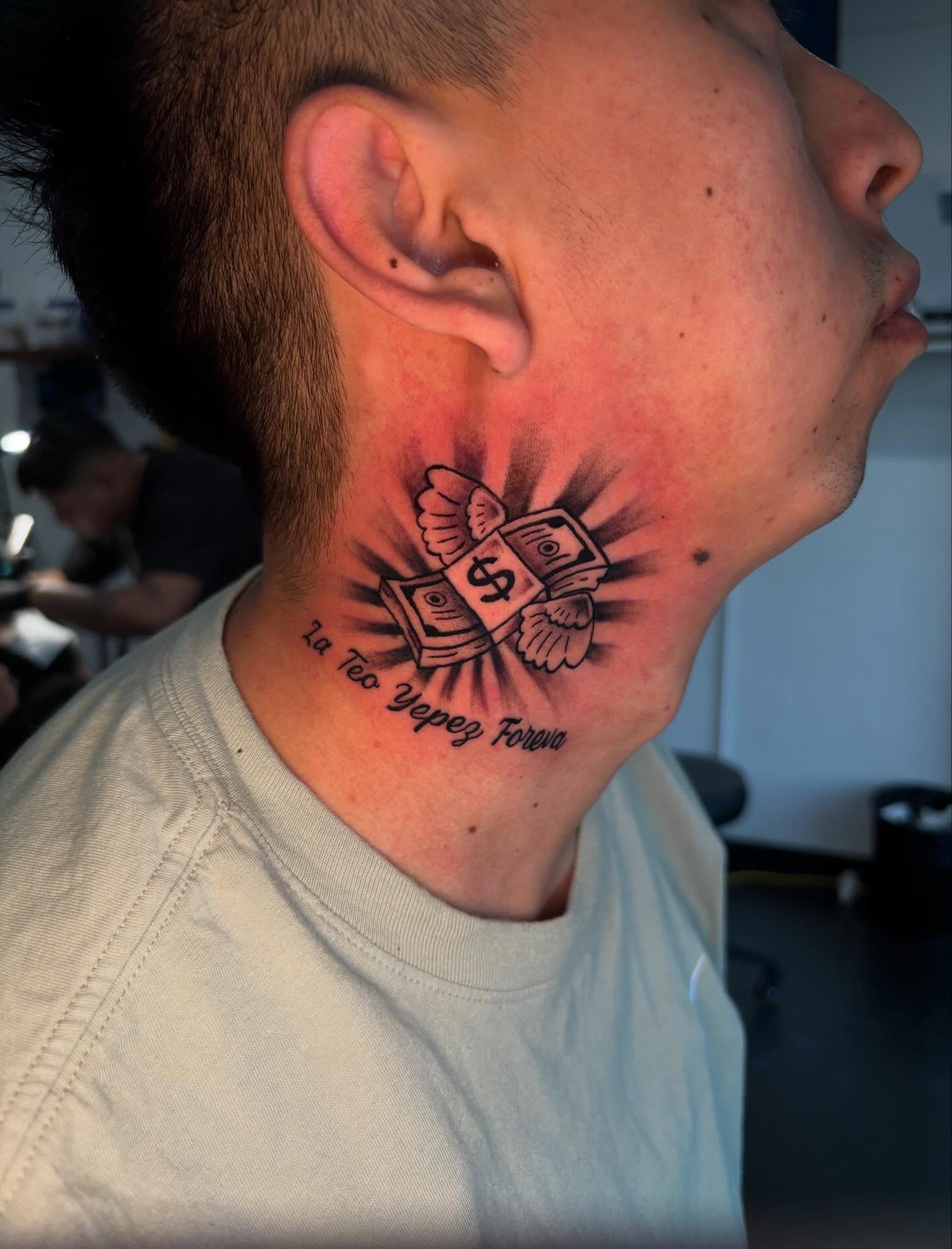 Money with wings black and grey tattoo on the neck by Daero Tattoo, New York, New York