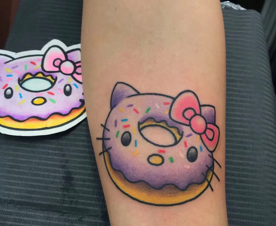 Donut dotwork tattoo on the forearm by Shawn Feng