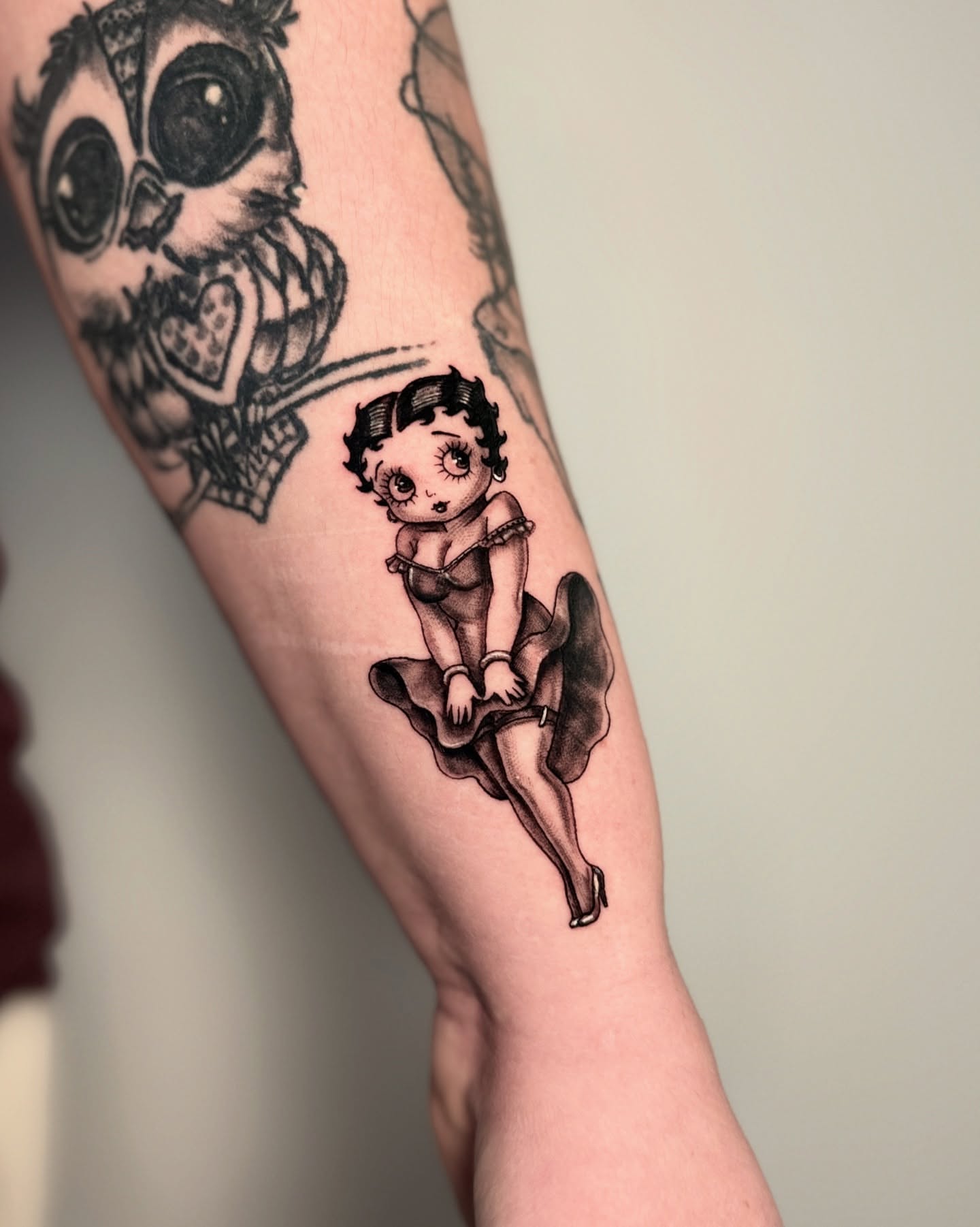 Betty Boop American traditional tattoo on the forearm by Alex Cantor