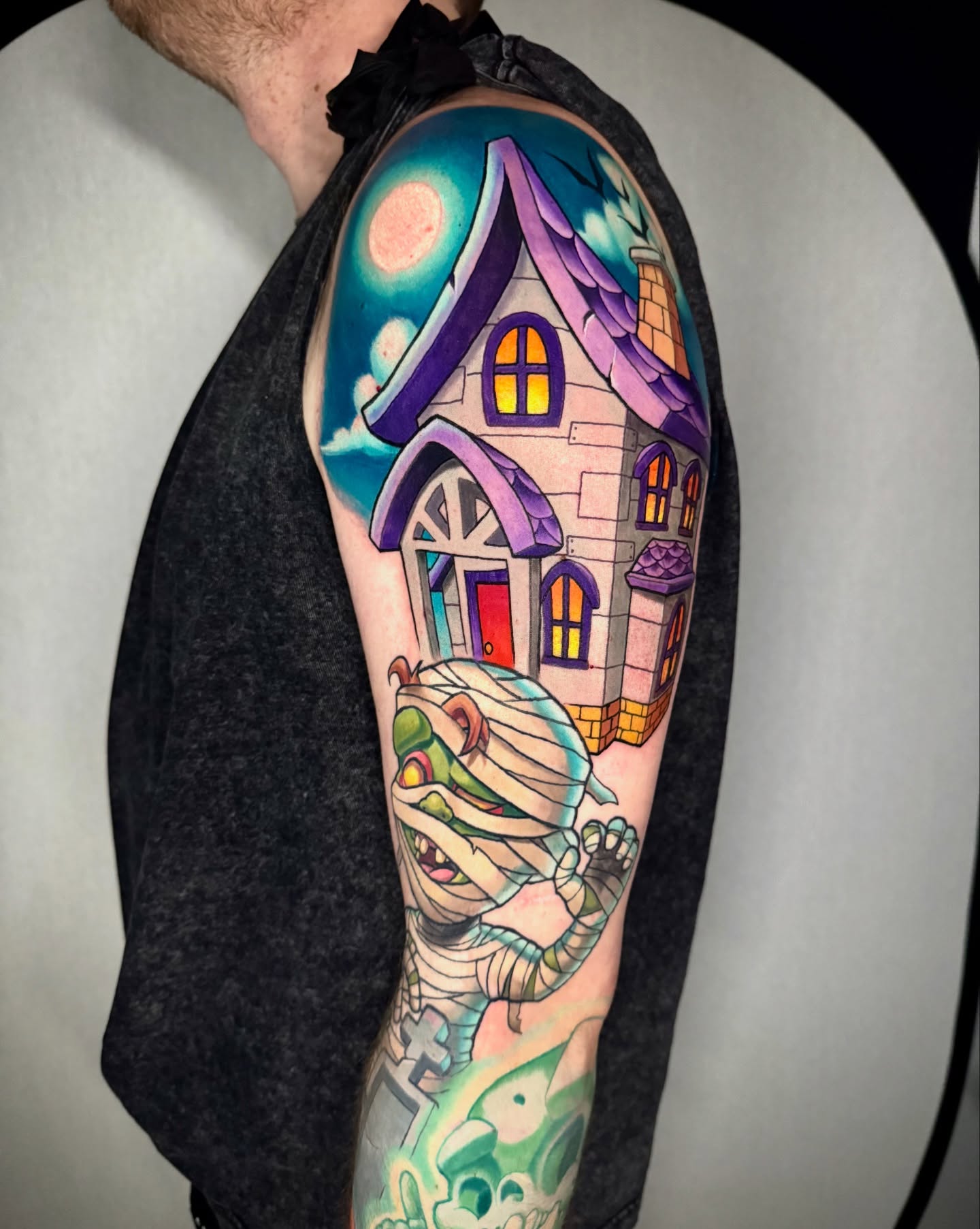 Haunted house and ghost American traditional tattoo on the forearm by Kevin Boudreau Newschool Tattoos