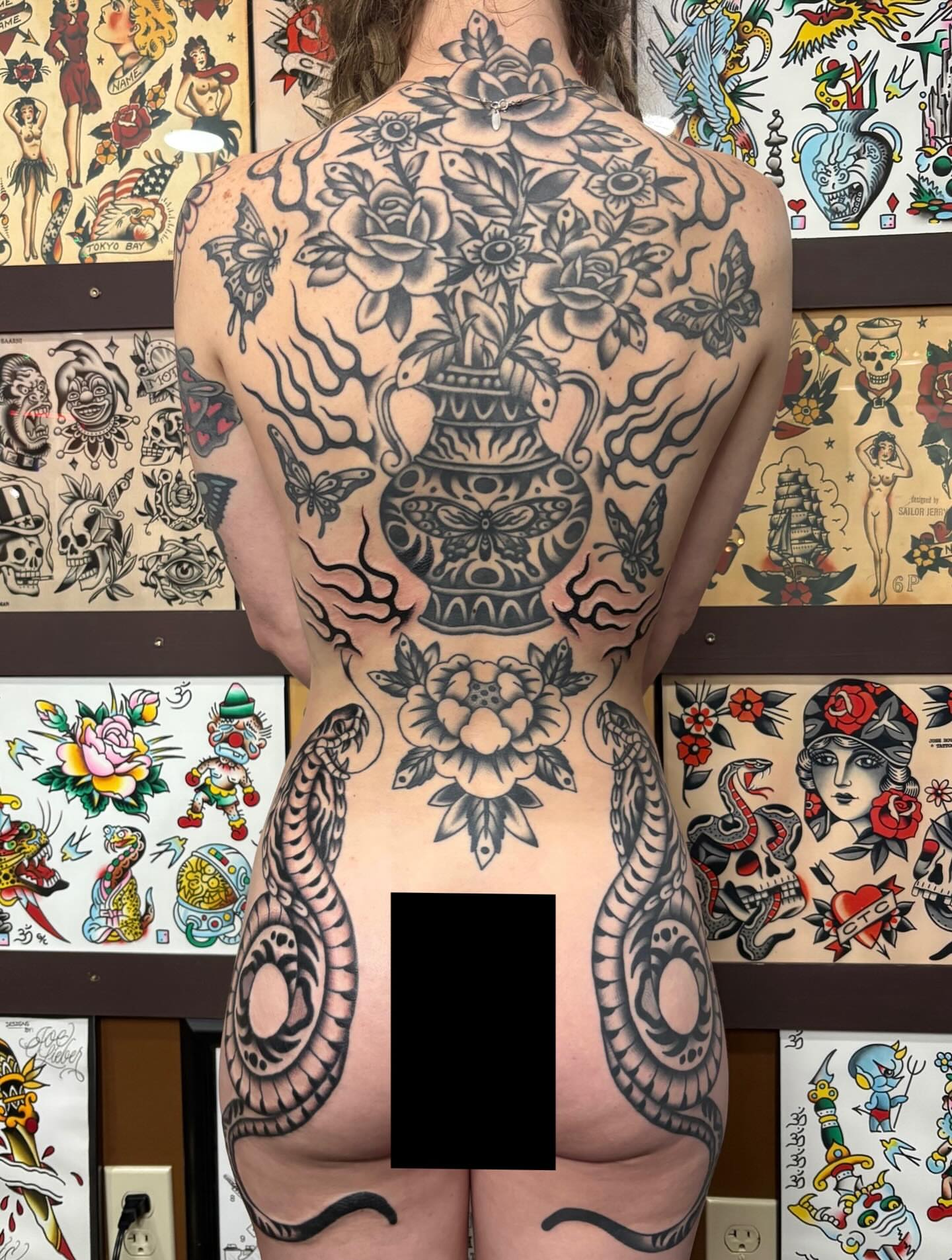 Floral arrangement with snakes American traditional tattoo on the back by sally ★ lee