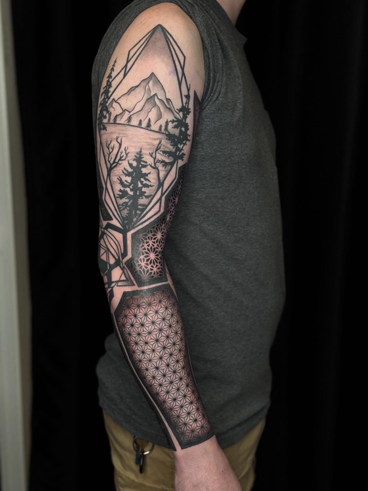 Mountain landscape geometric tattoo on the forearm by Ashley Hsiung *Panda*