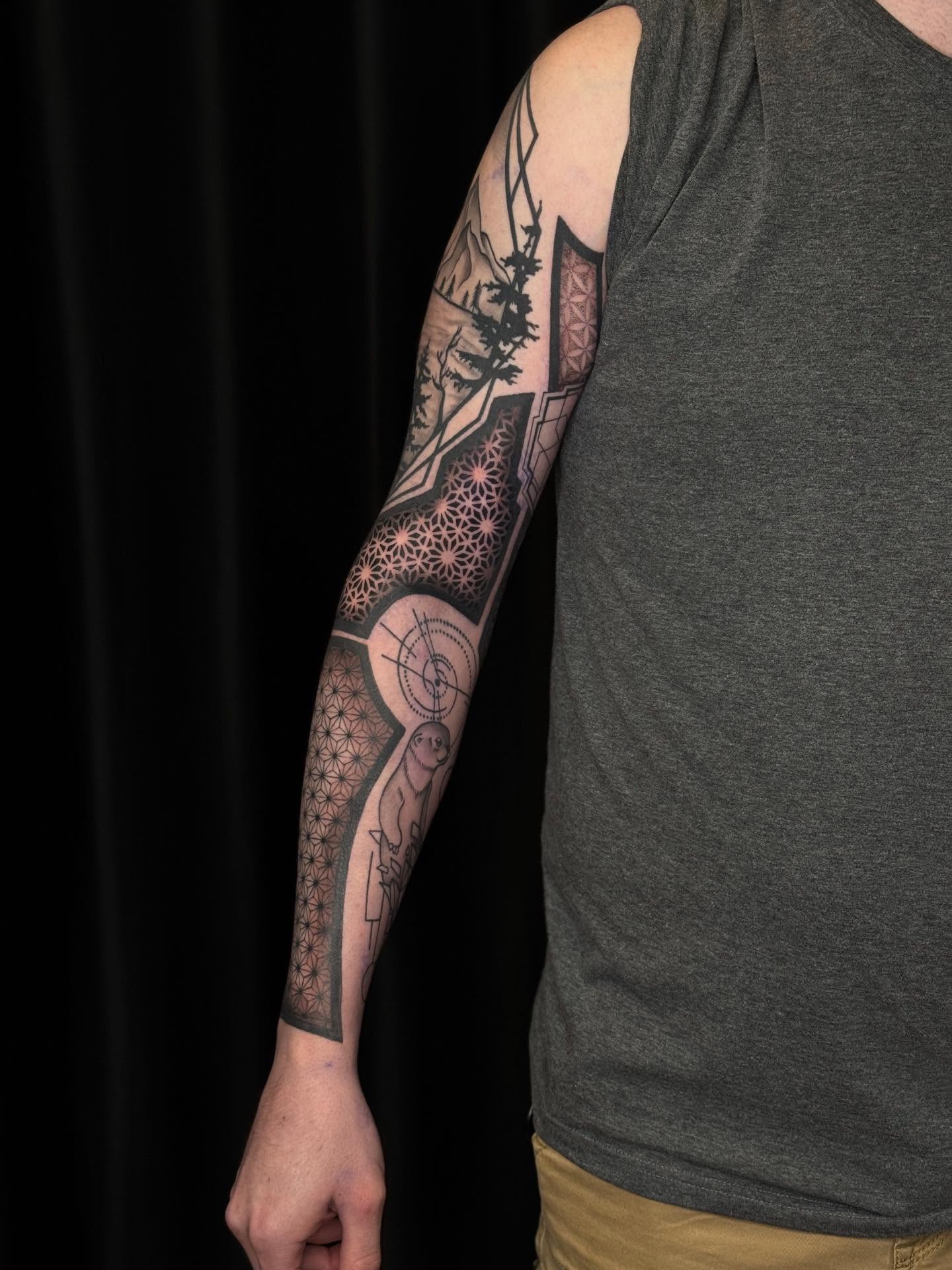 Geometric landscape geometric tattoo on the upper arm by Ashley Hsiung *Panda*
