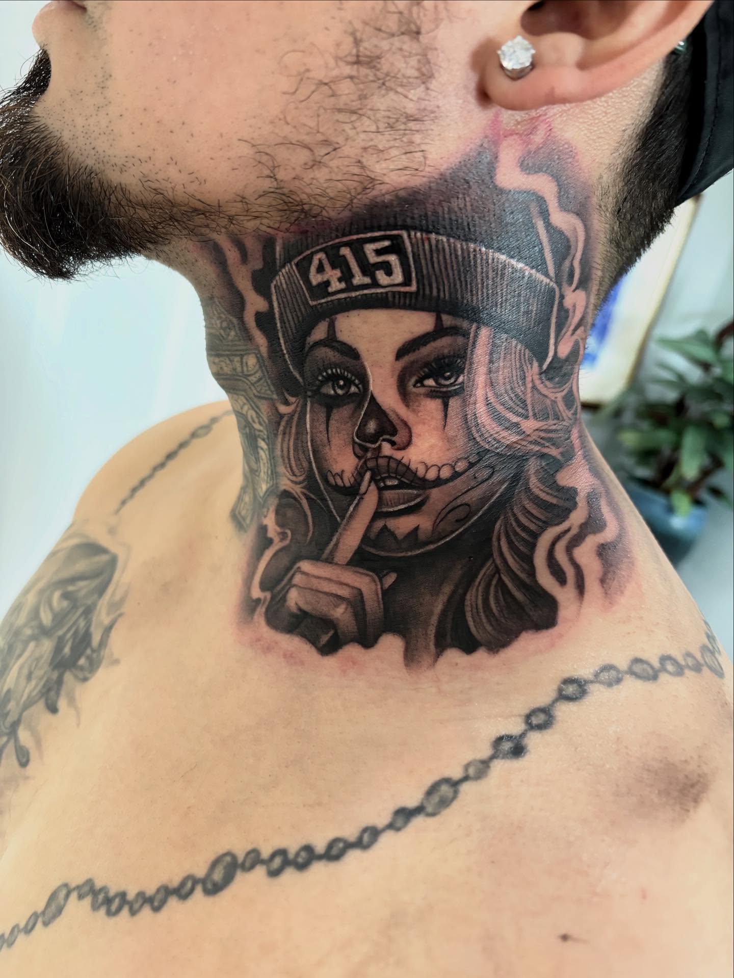 Woman with skull makeup realism tattoo on the neck by Juan Lira