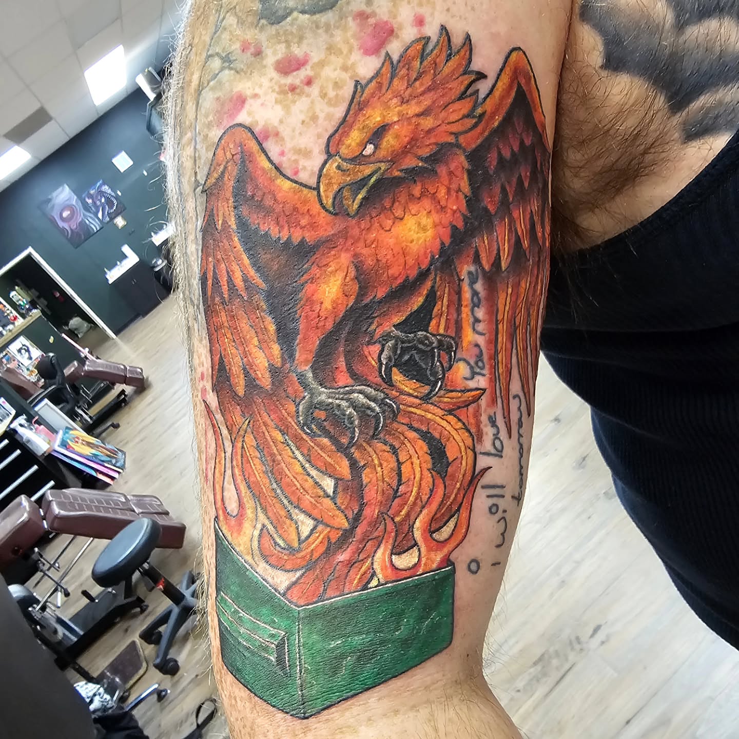Phoenix realism tattoo on the forearm by Derek Davis