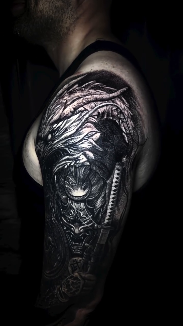 Samurai warrior with dragon and skulls Japanese tattoo on the shoulder by Raciel Fabian Romero