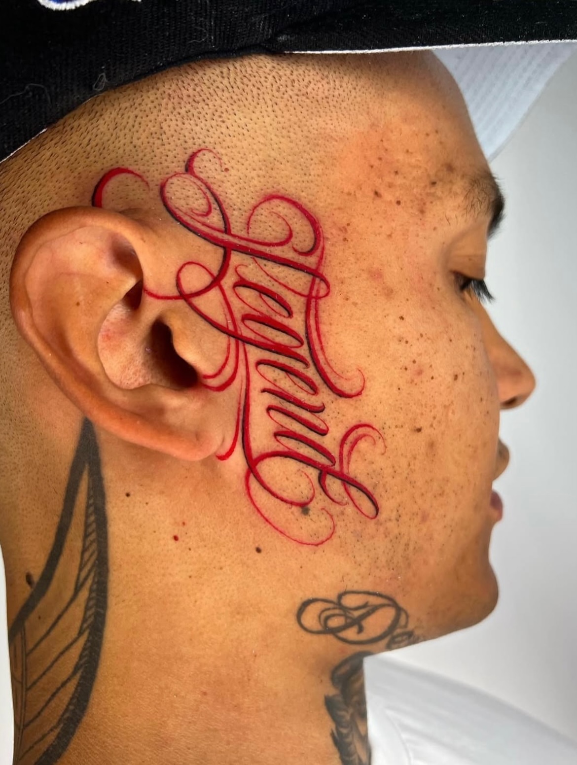 Script lettering lettering script tattoo on the head by Lettering