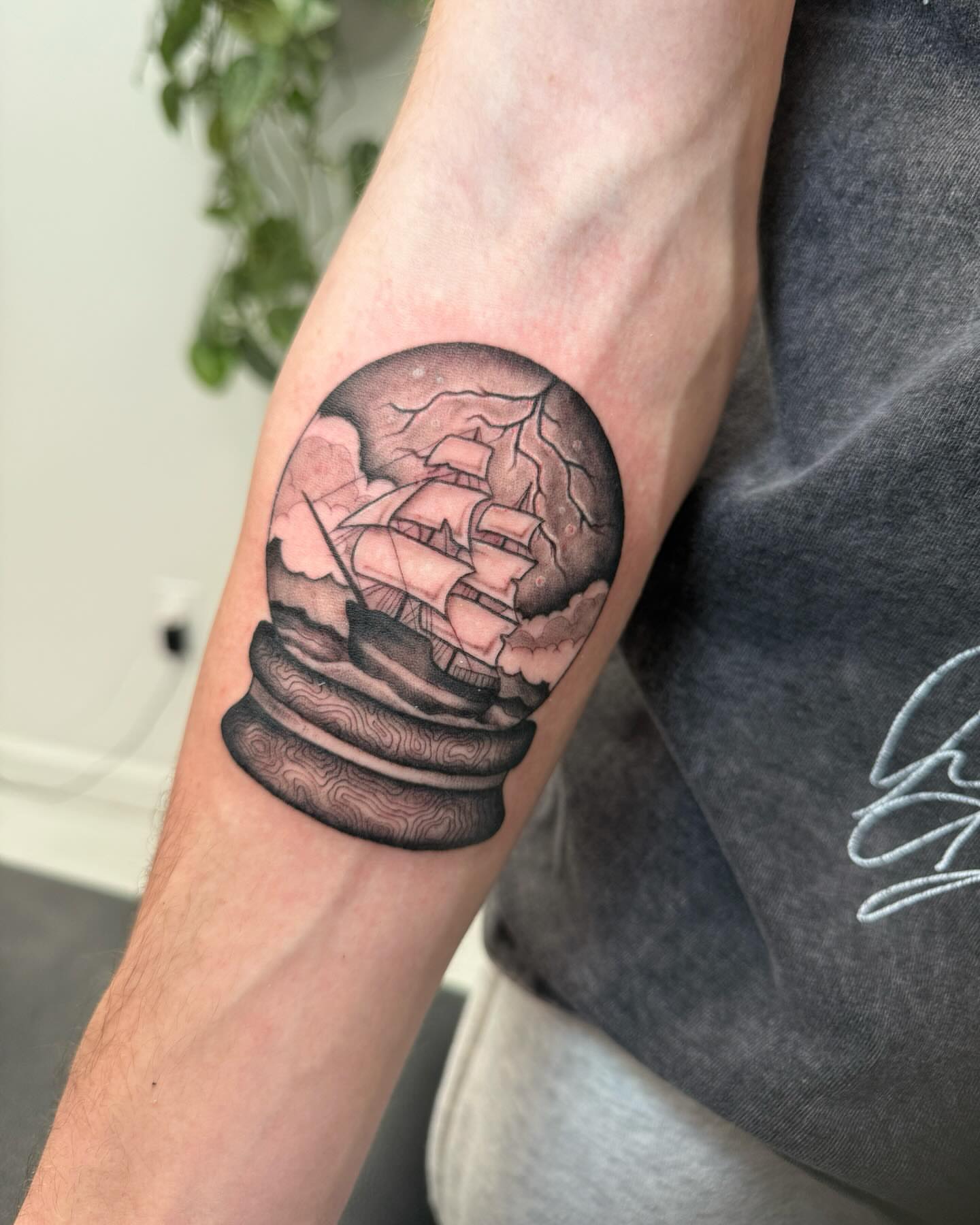 Ship in a bottle realism tattoo on the forearm by Kaitlyn Brebner