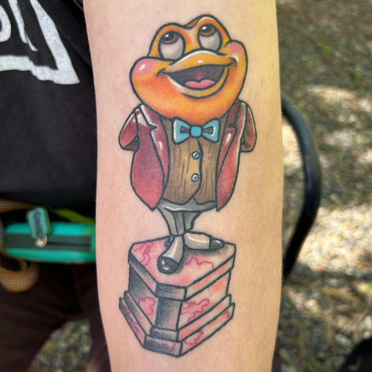 Duck character new school tattoo on the forearm by Katie Beth