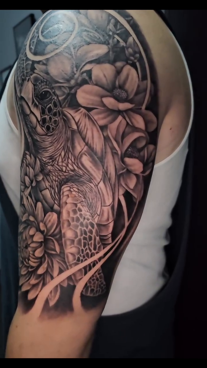 Owl and flowers sleeve tribal tattoo on the upper arm by Mac Obaob
