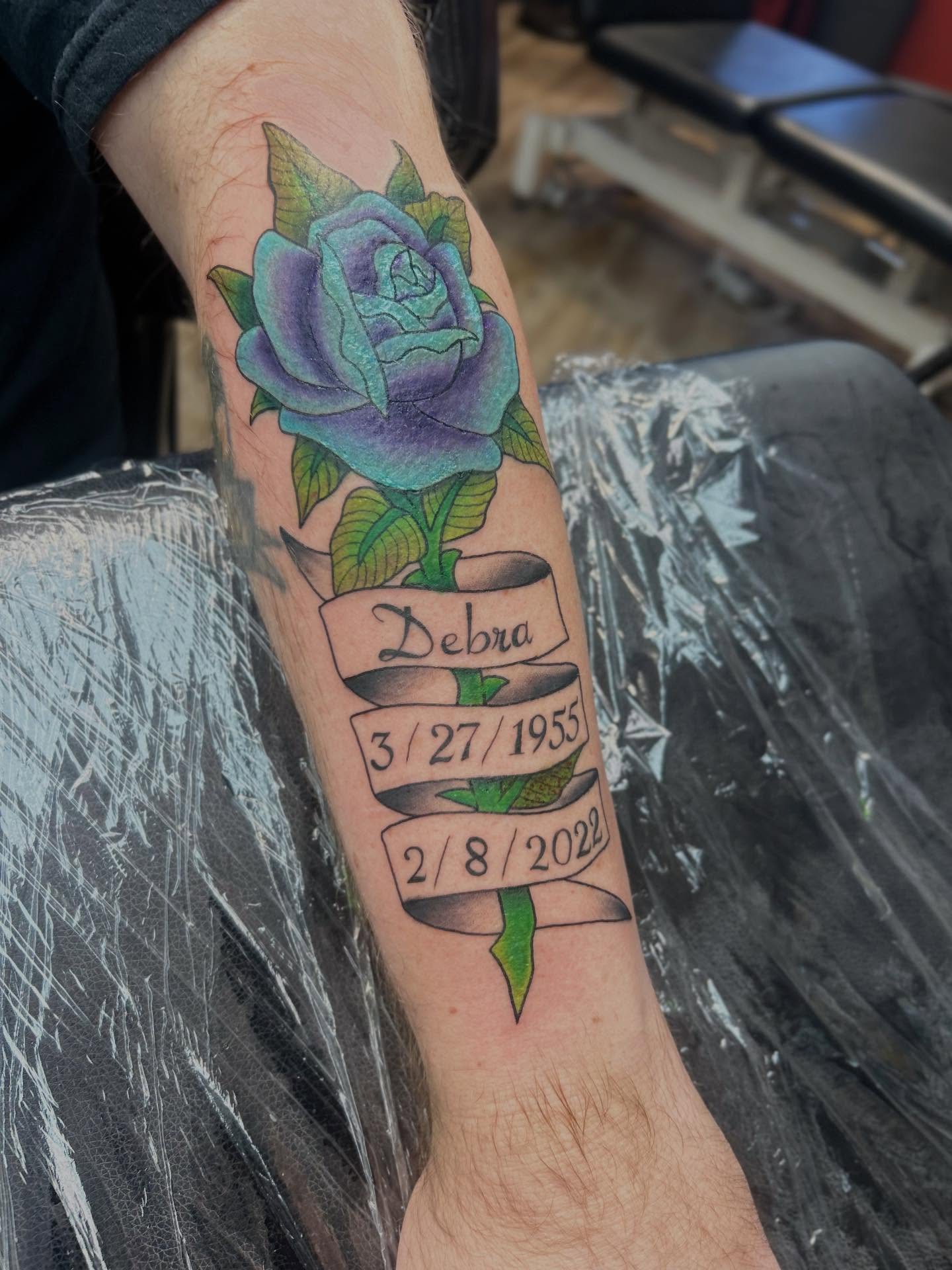 Rose and ribbon American traditional tattoo on the forearm by Ricardo (RJ)