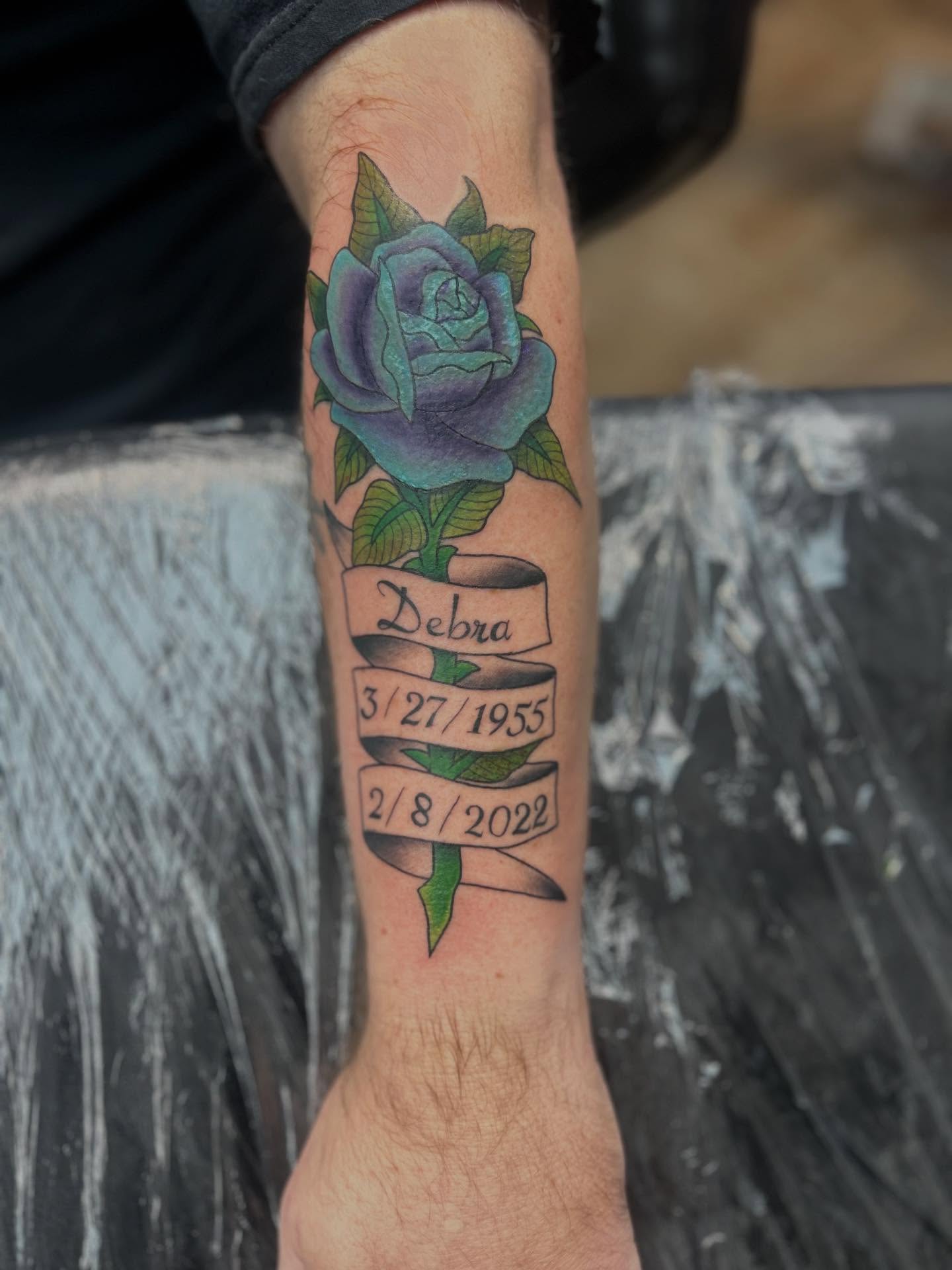 Purple rose with banner realism tattoo on the forearm by Ricardo (RJ)