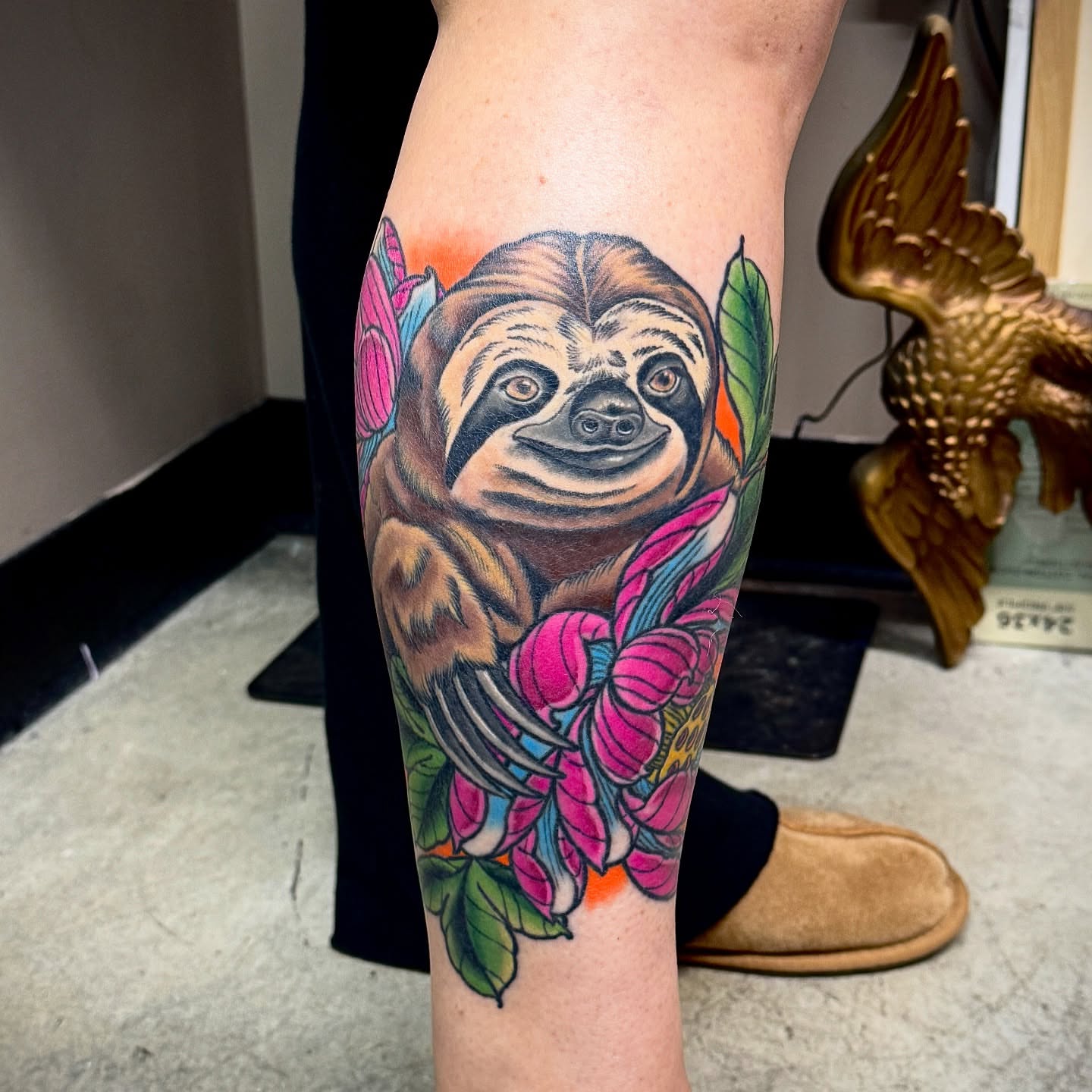 Sloth and flowers American traditional tattoo on the forearm by Derek Cilla, Bethlehem, Pennsylvania
