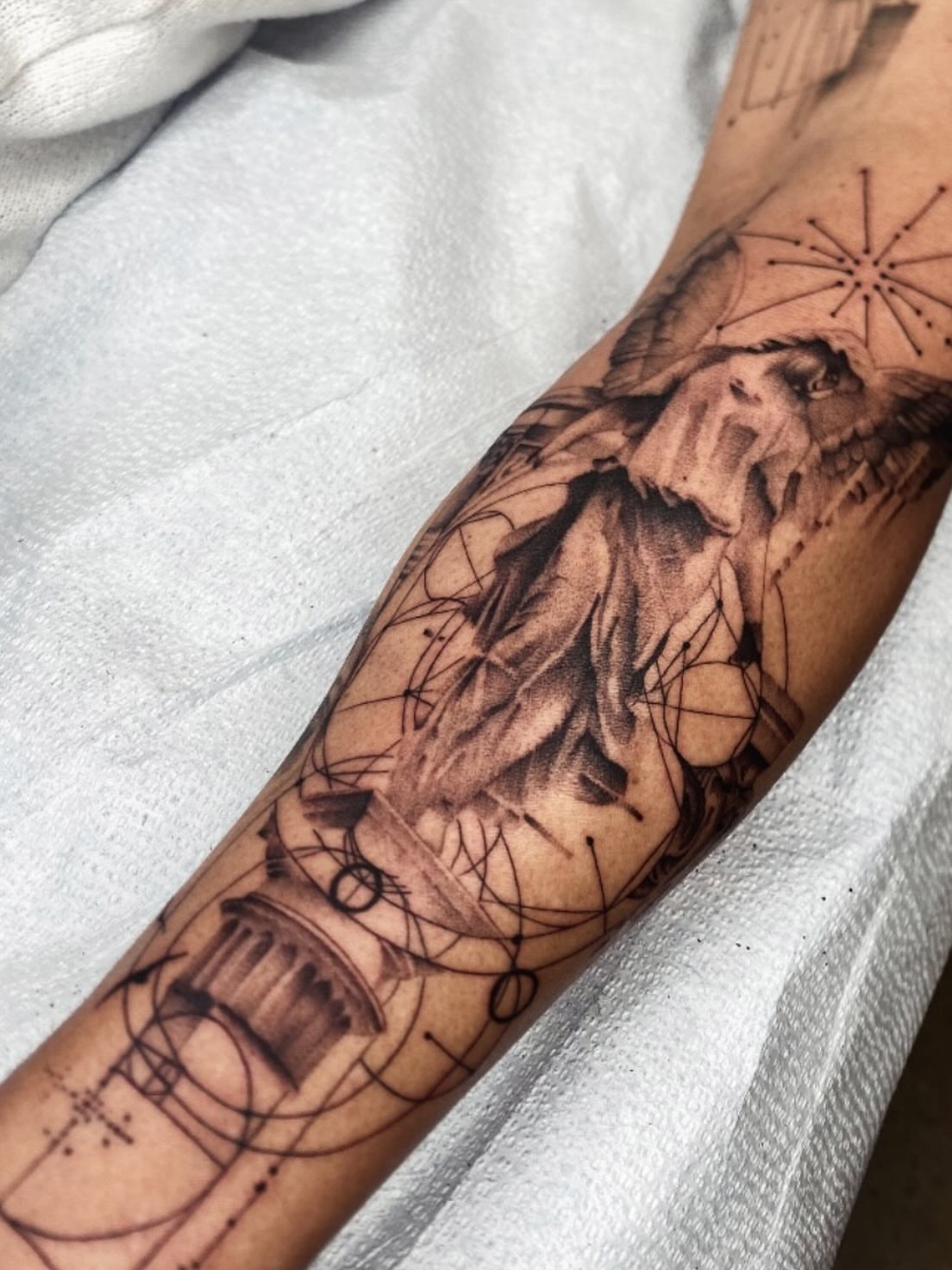 Statue realism tattoo on the forearm by Cody Mason