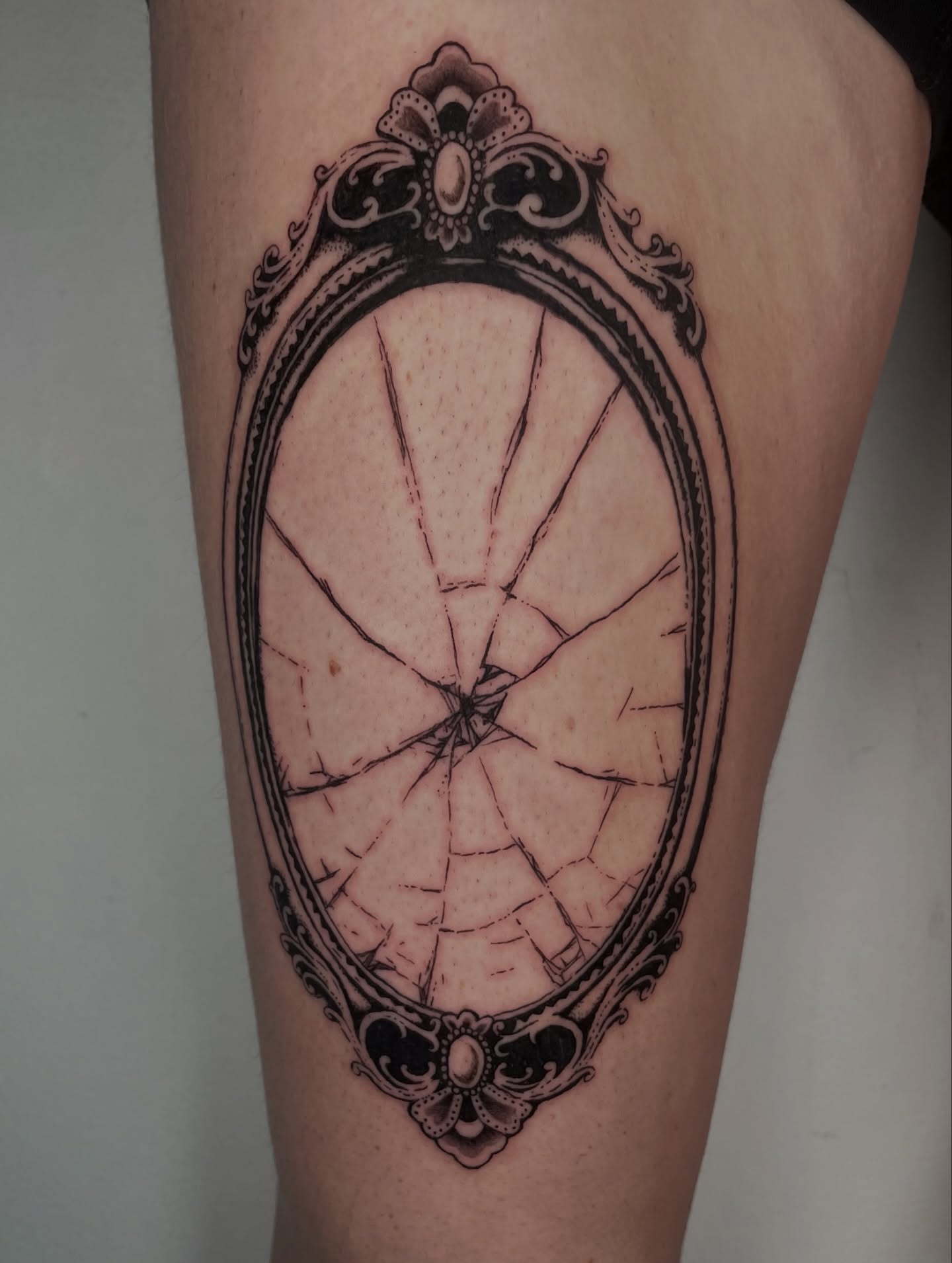 Broken mirror geometric tattoo on the forearm by Sophia Tattoo