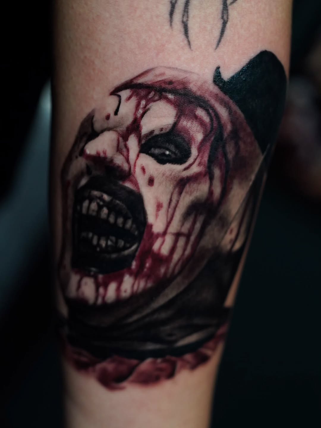 Horror skull dark realism tattoo on the forearm by Dan Redding