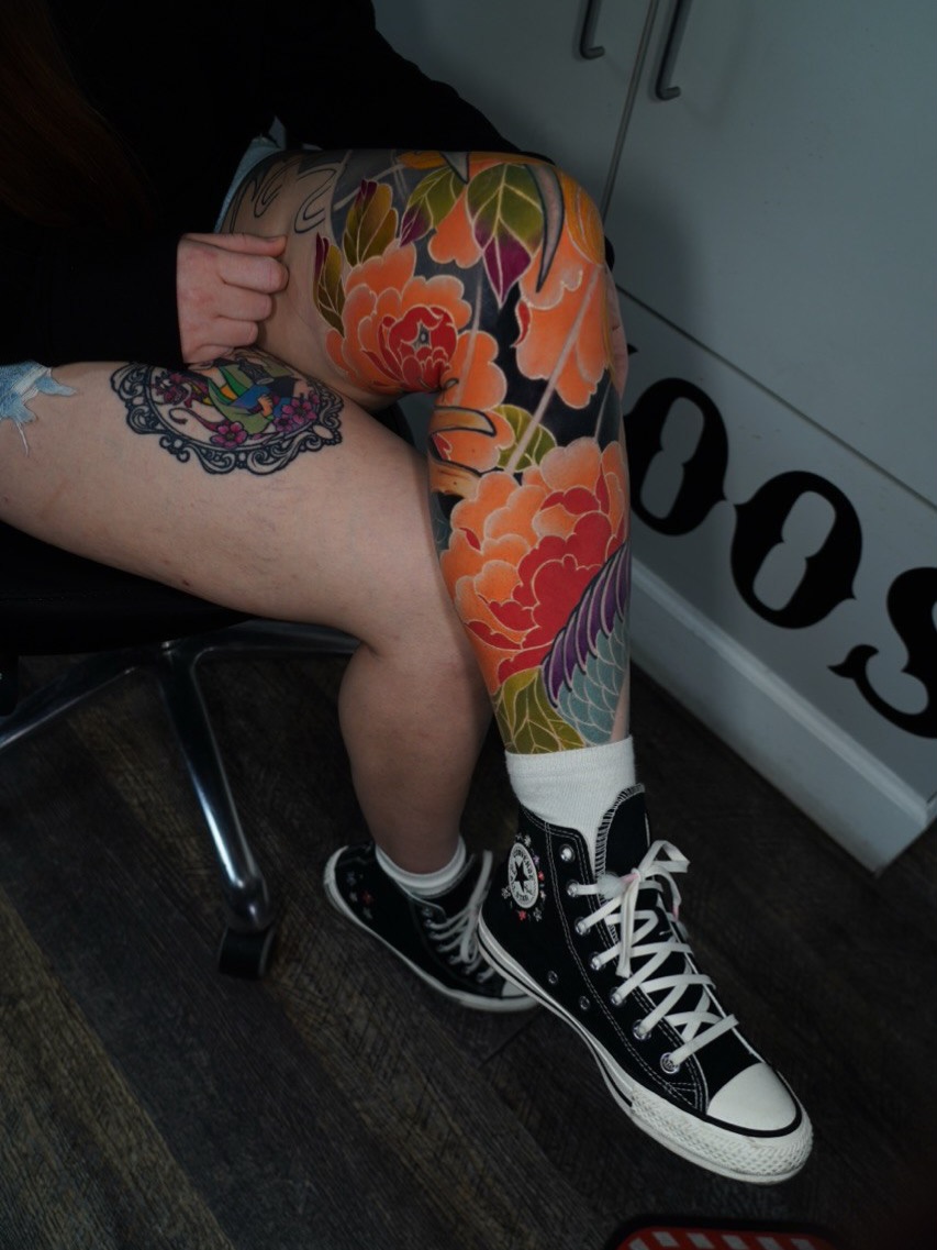 Floral design japanese irezumi tattoo on the leg by Grego Hernandez, Miami, Florida