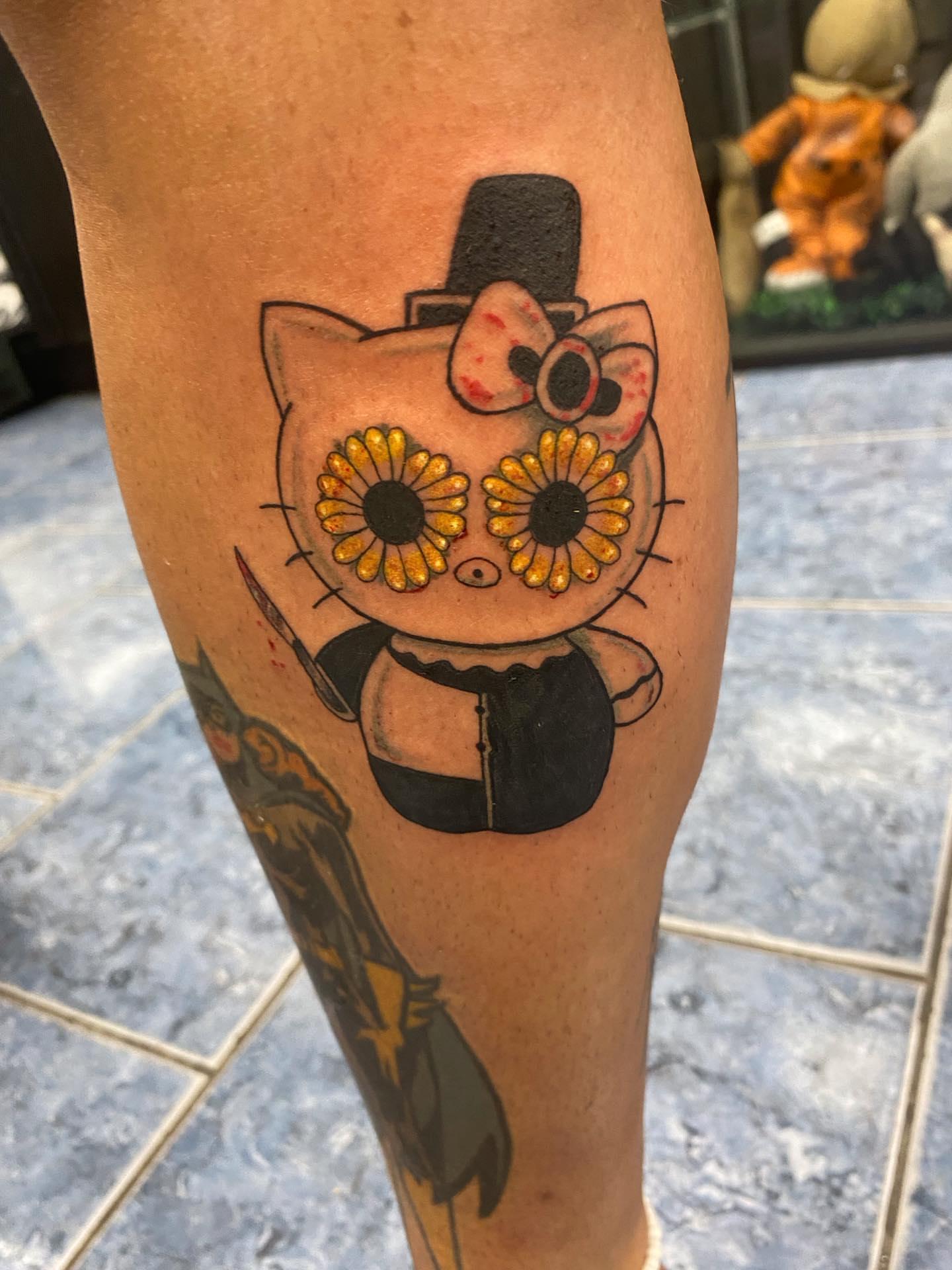 Cat with sunflower eyes American traditional tattoo on the forearm by @artinjections667