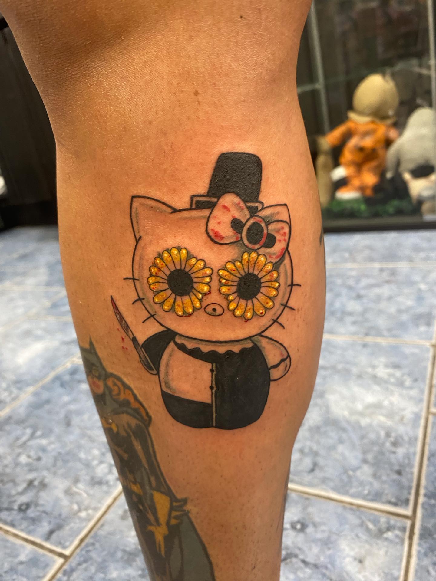 Cat with sunflower eyes dotwork tattoo on the thigh by @artinjections667