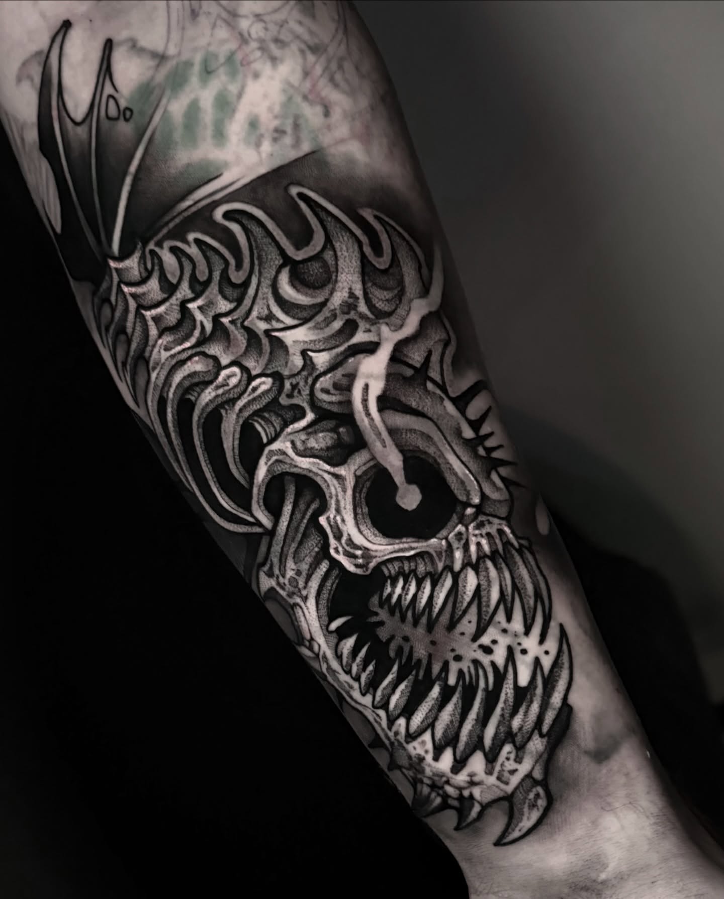 Skull dark realism tattoo on the forearm by Clayton Smith (BEAR)